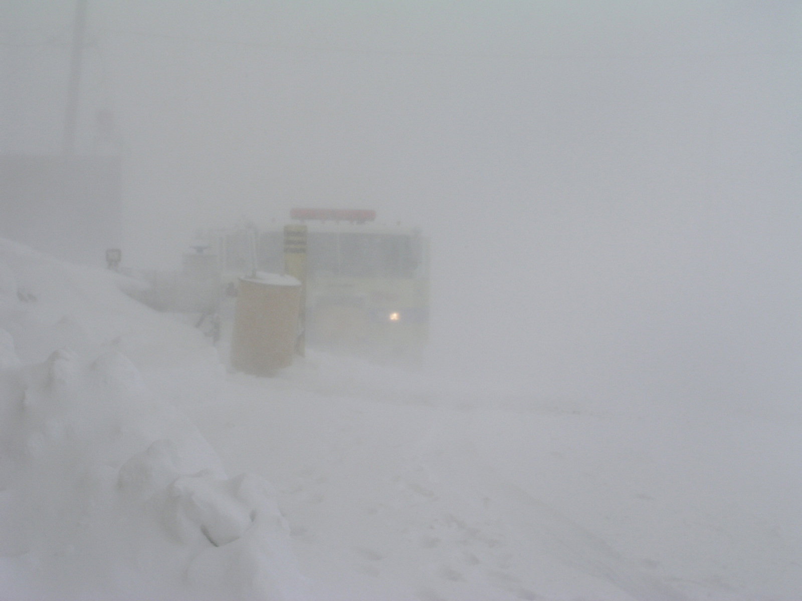 A fire truck in a blizzard.