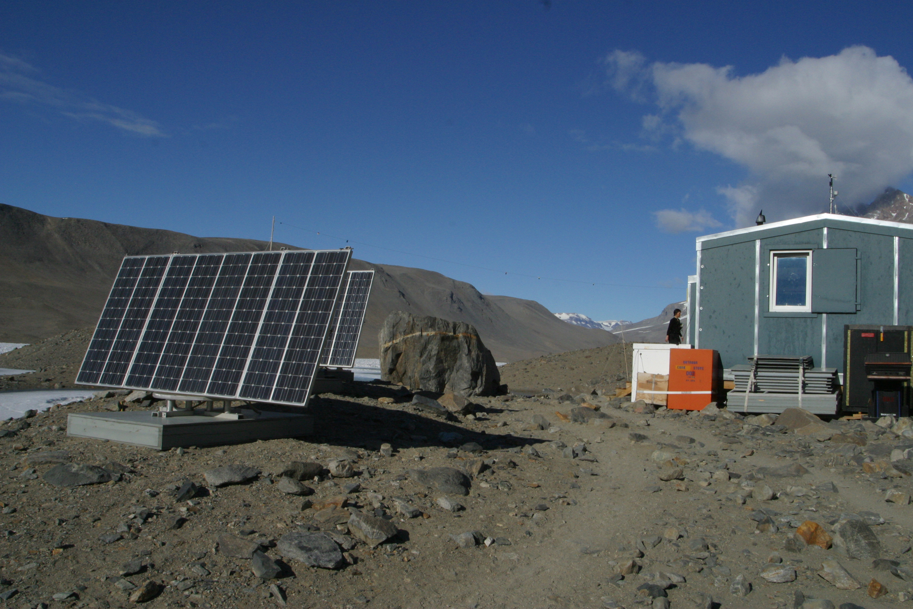 Solar panels next to a building.