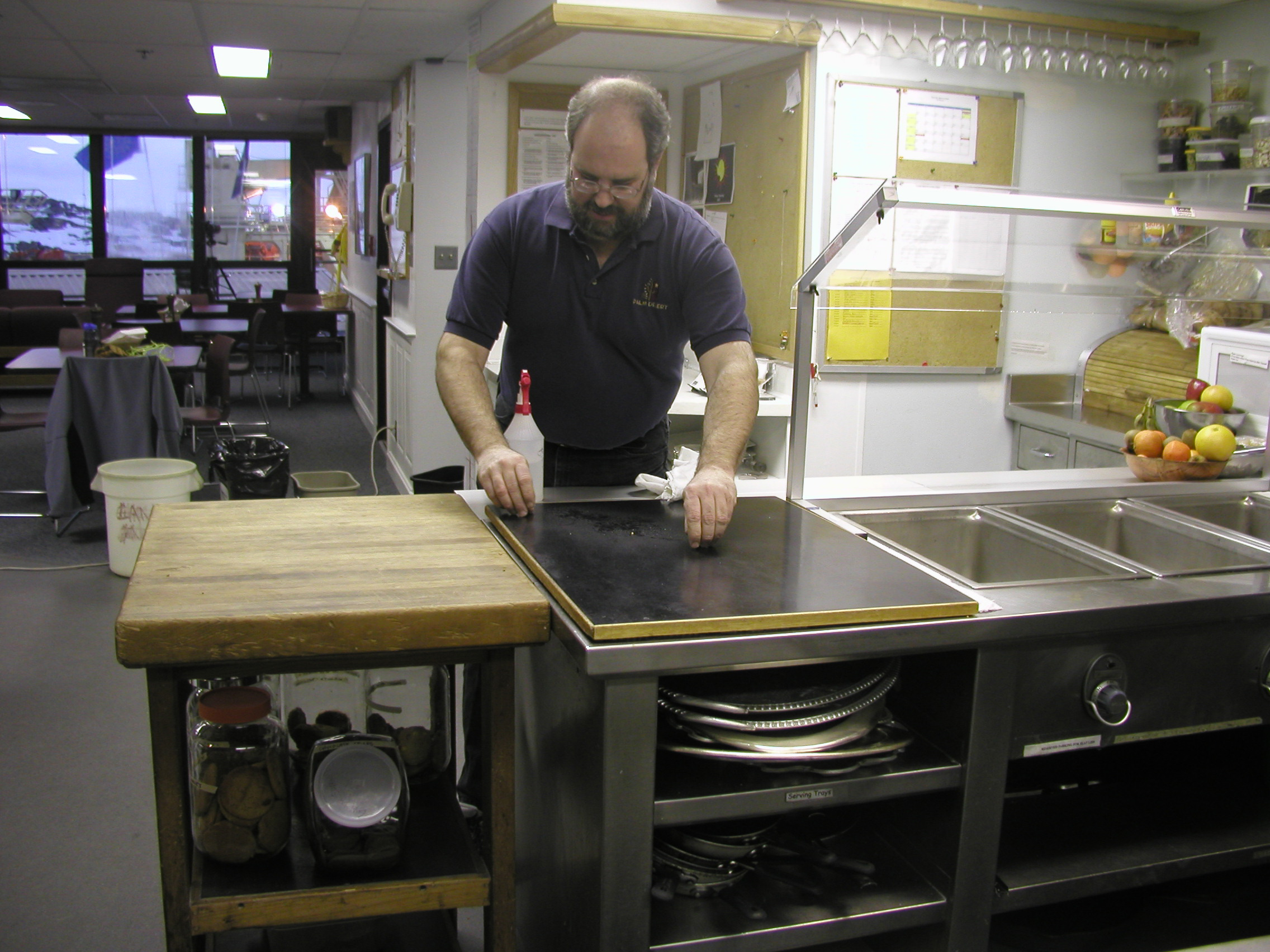 Man wiping counter.