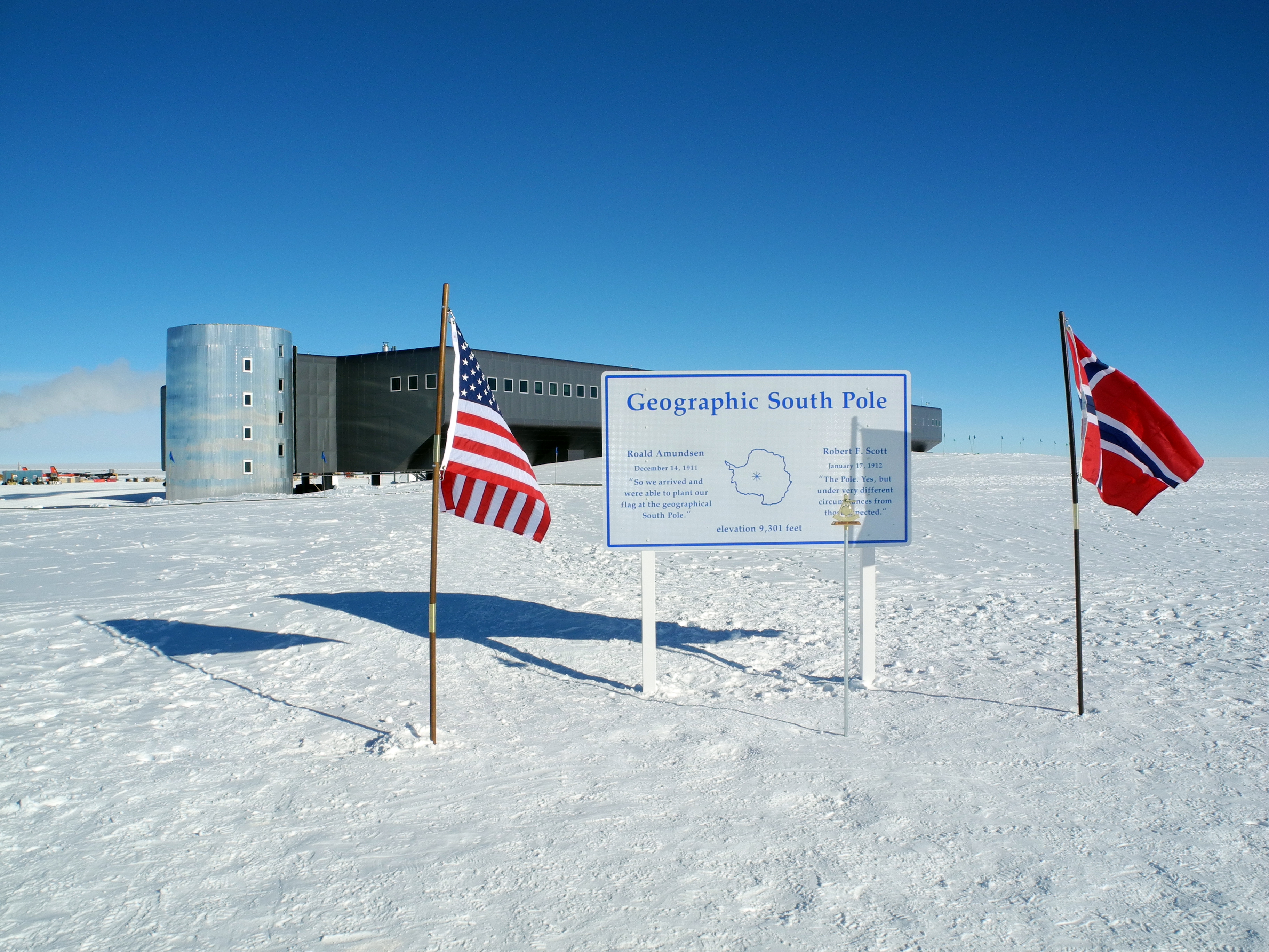 A sign with two national flags.