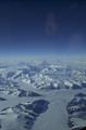 Aerial of snow and glacier covered mountains.