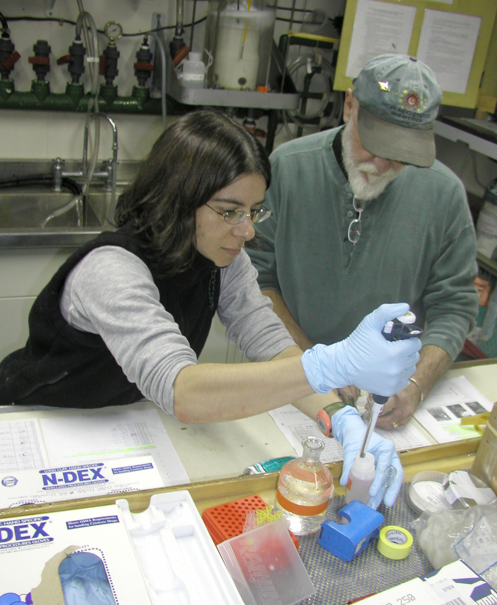 A man and a woman in a science lab.