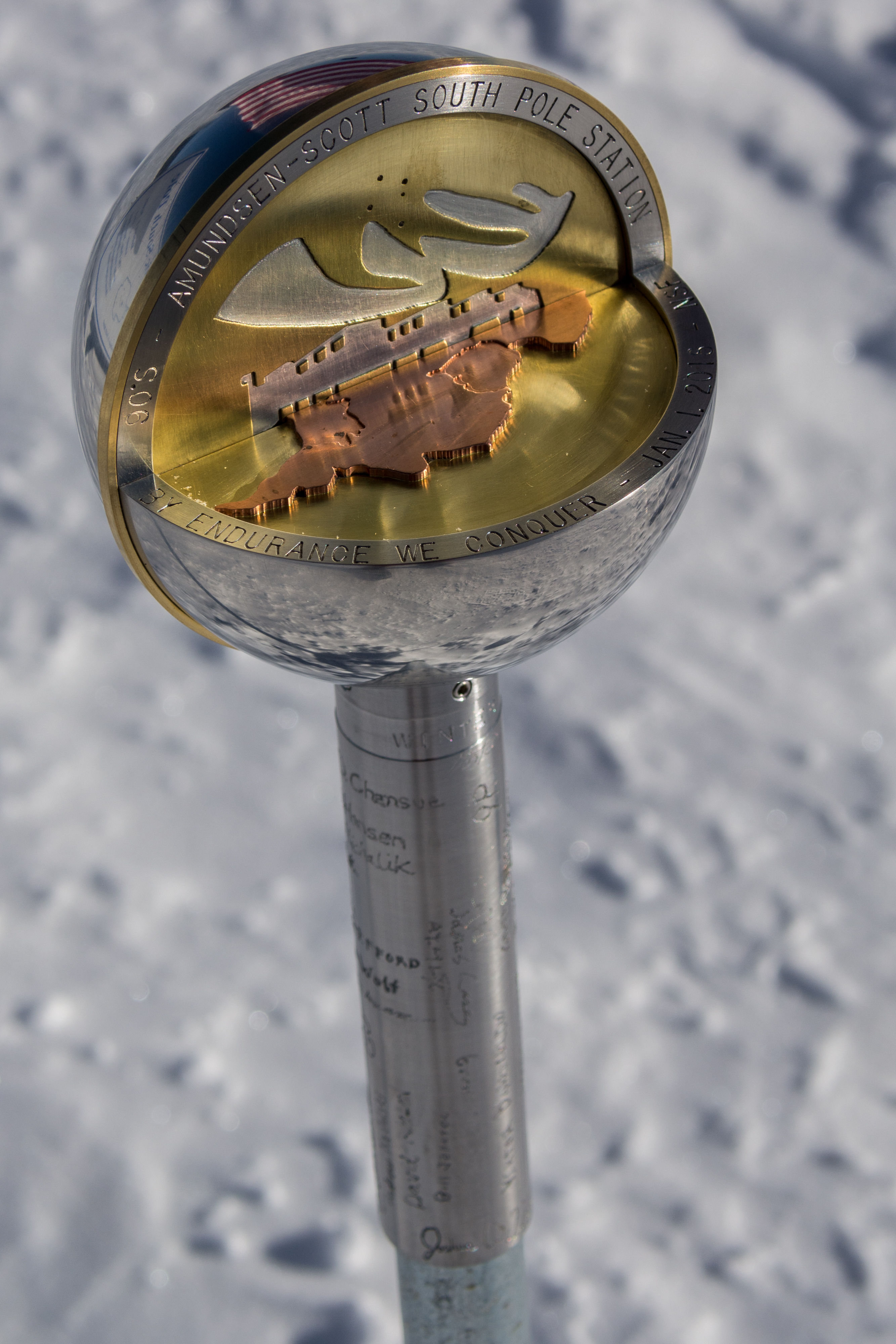 A metal sphere on top of a post. 