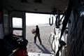 Person unloads a helicopter.