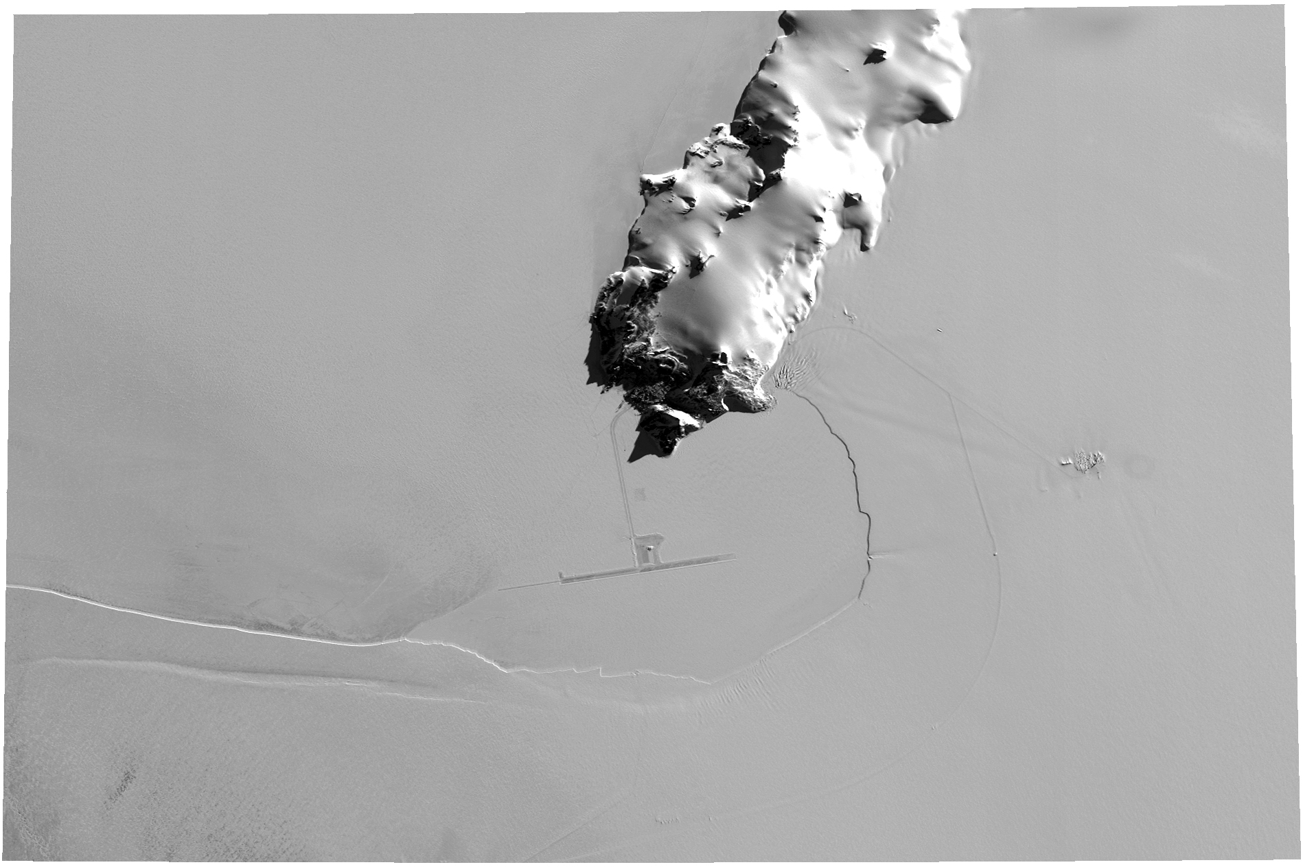Aerial photo of land and snow.