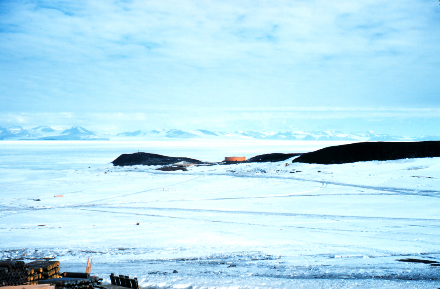 Ice surrounds a peninsula of land.