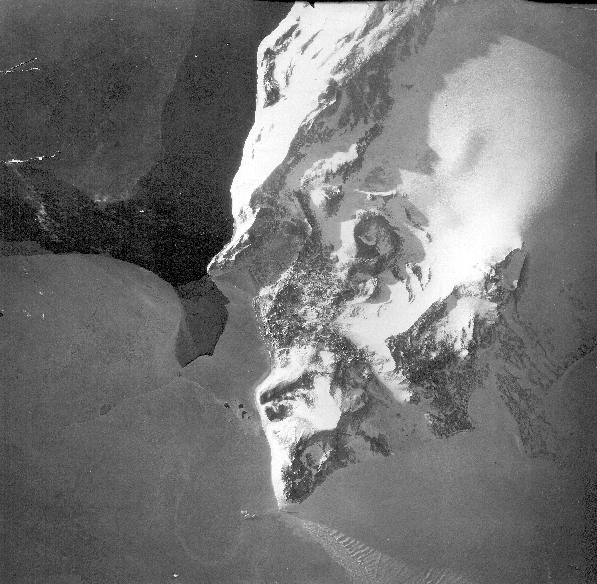 Aerial view of land, water and ice.