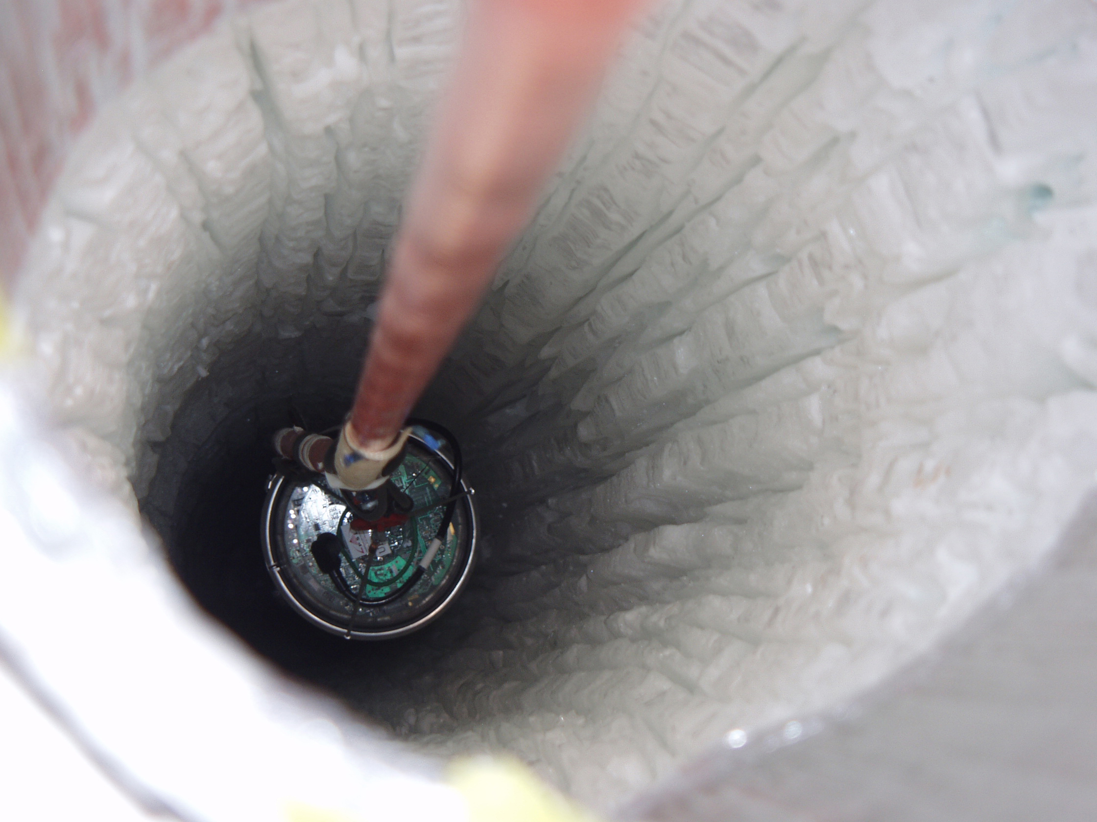 An object in a hole in ice.