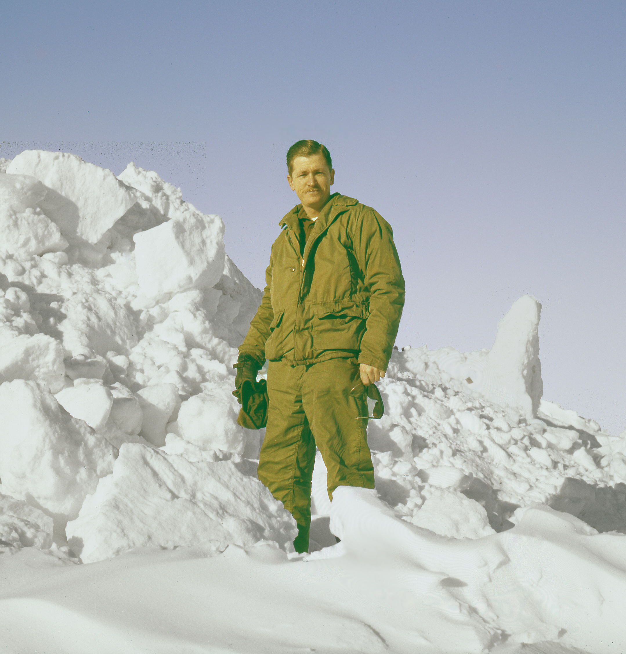 A man stands in snow.