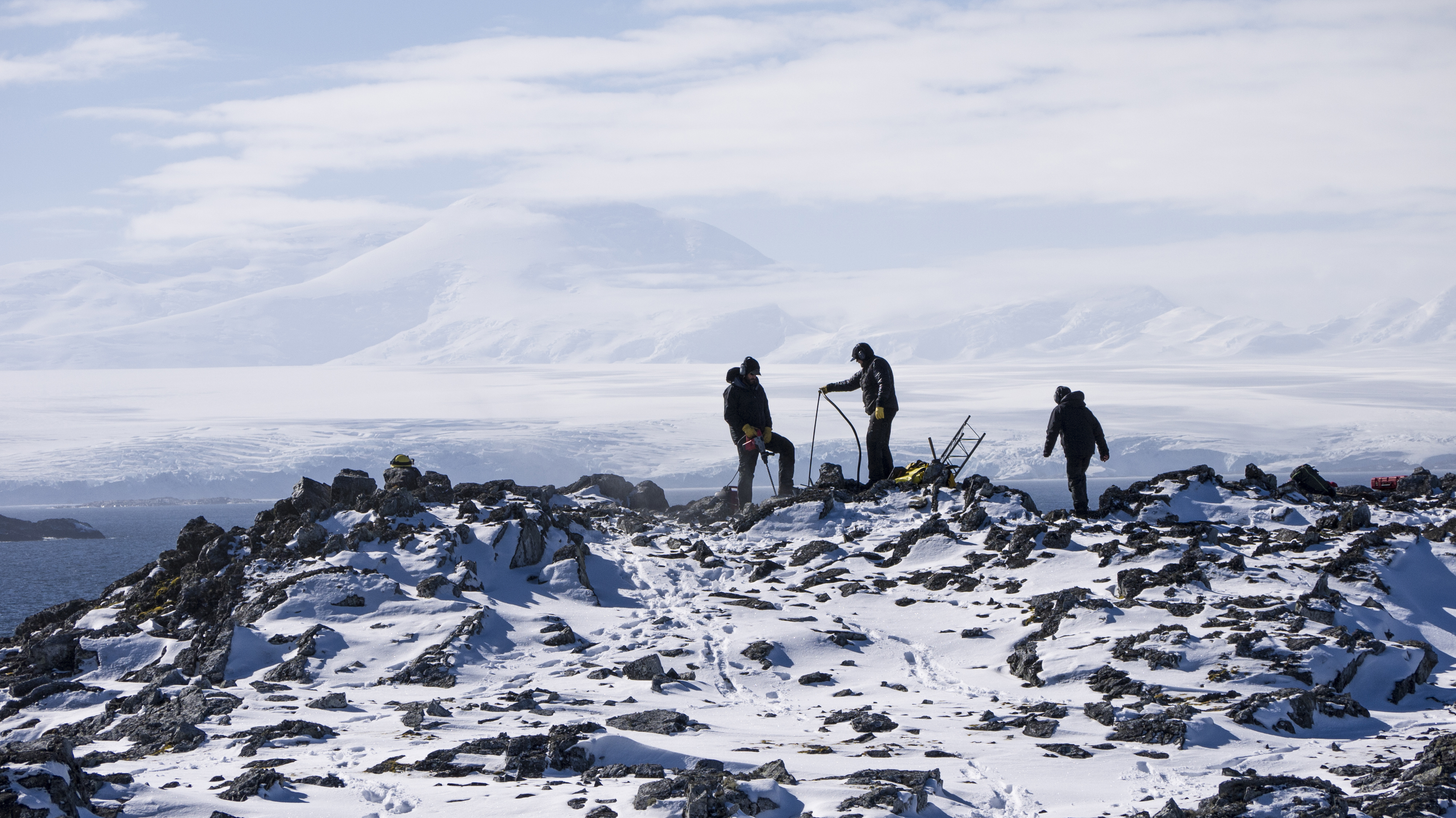 People working in a rocky area.