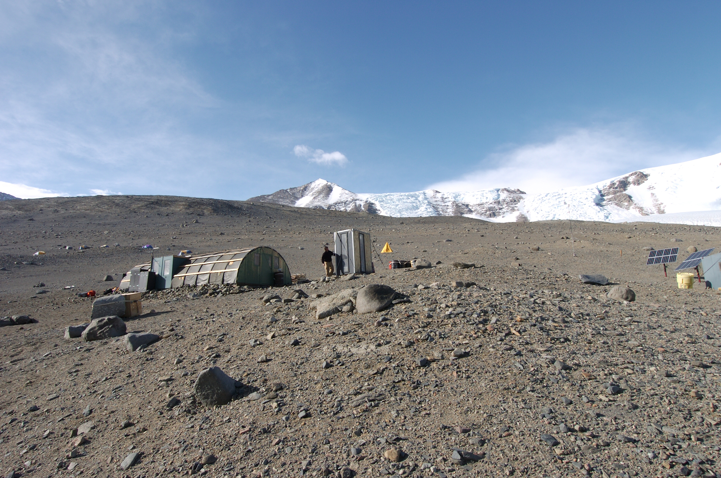 Small buildings on rocky terrain.