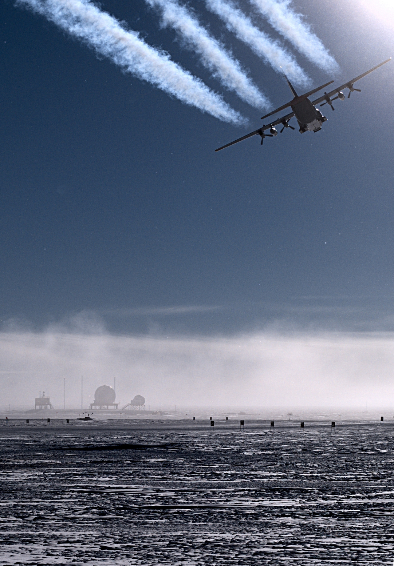 An airplane leaves contrails in the air.