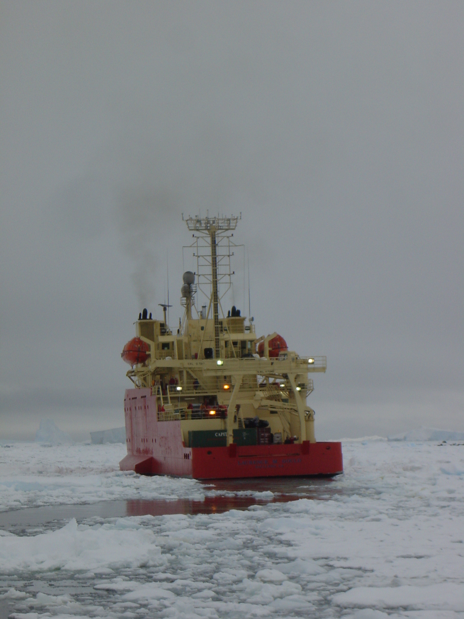 The rear of a ship in icy water.