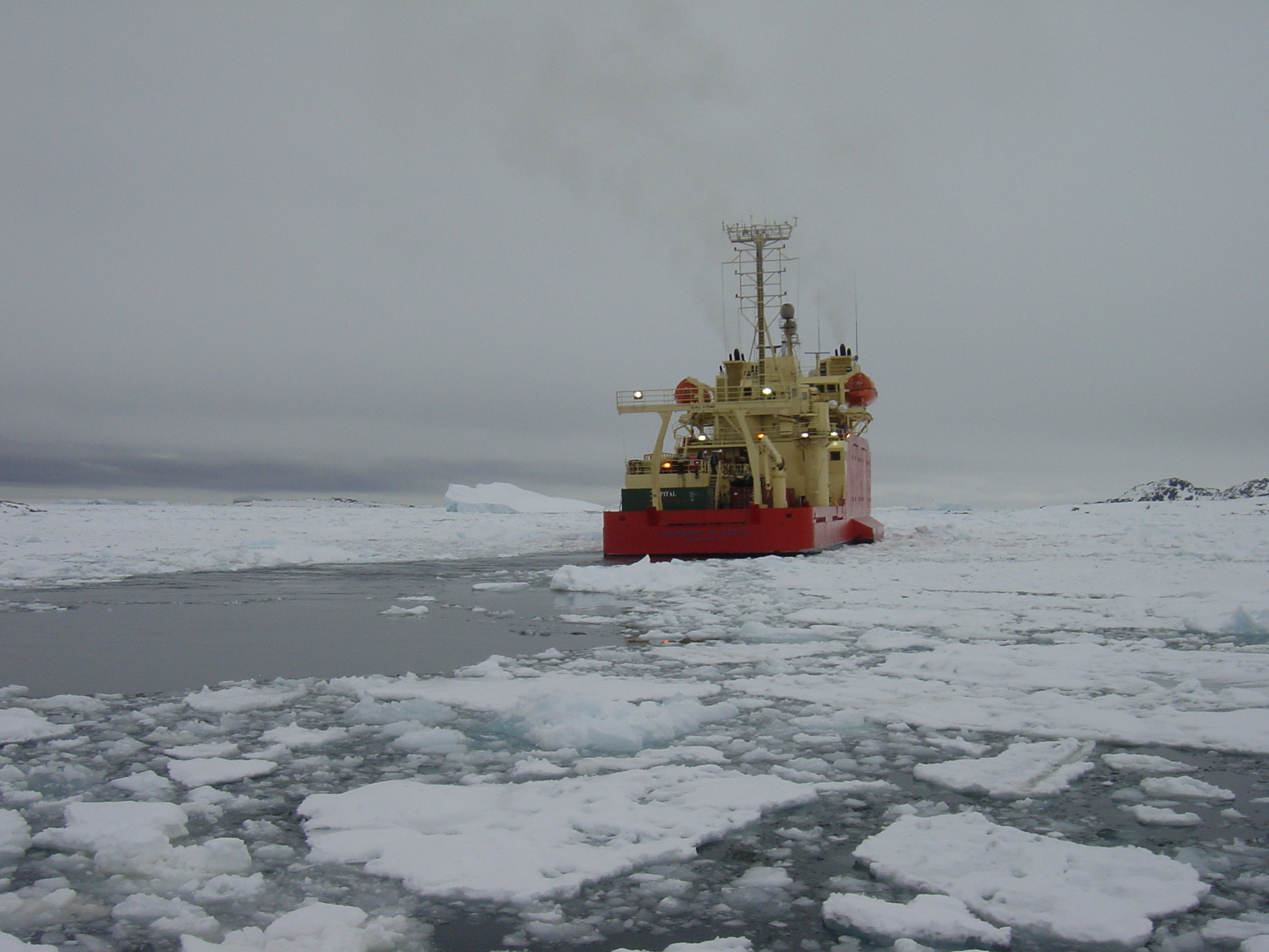 The rear of a ship in icy water.