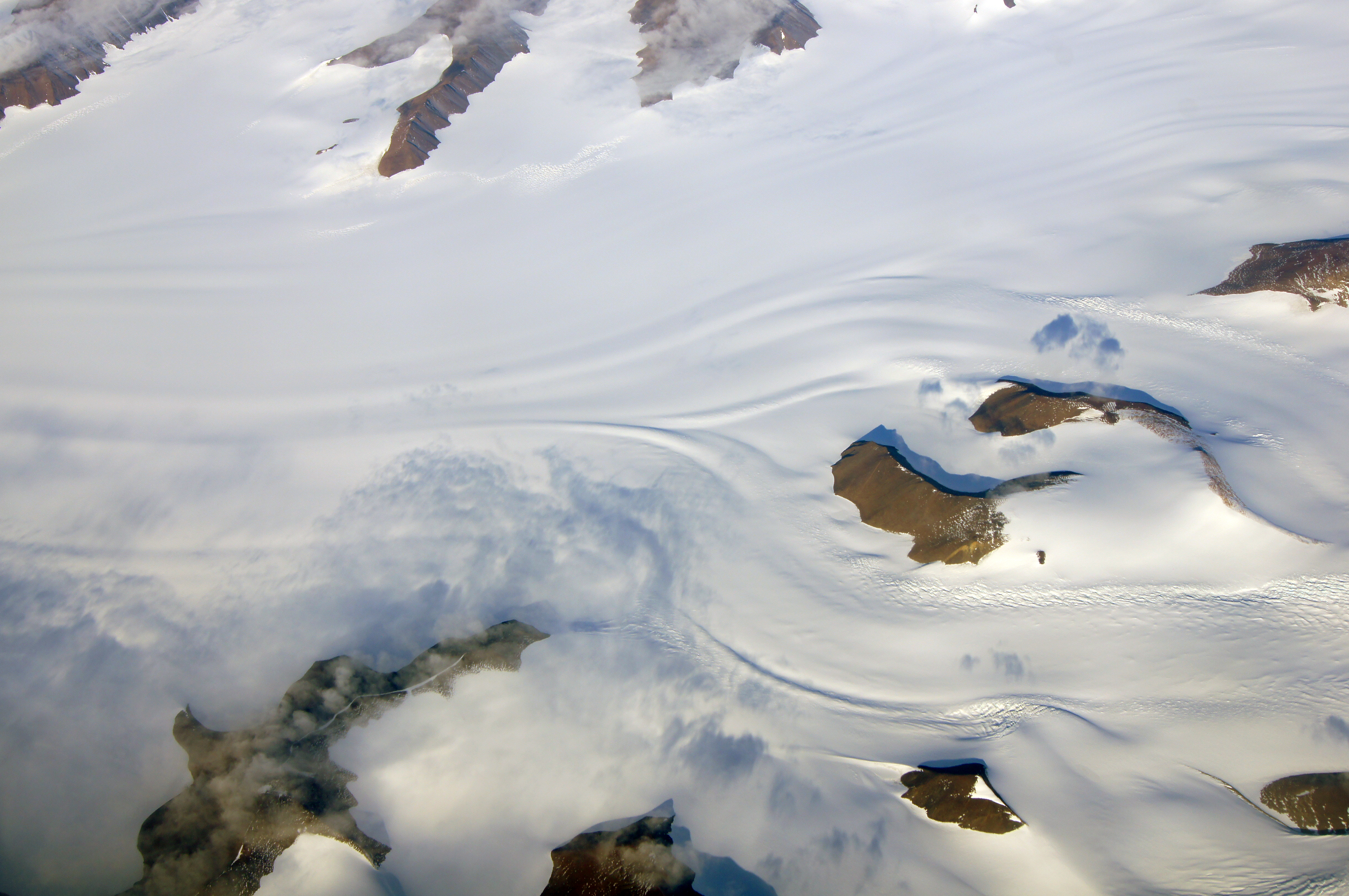 Aerial photo of snow and land.