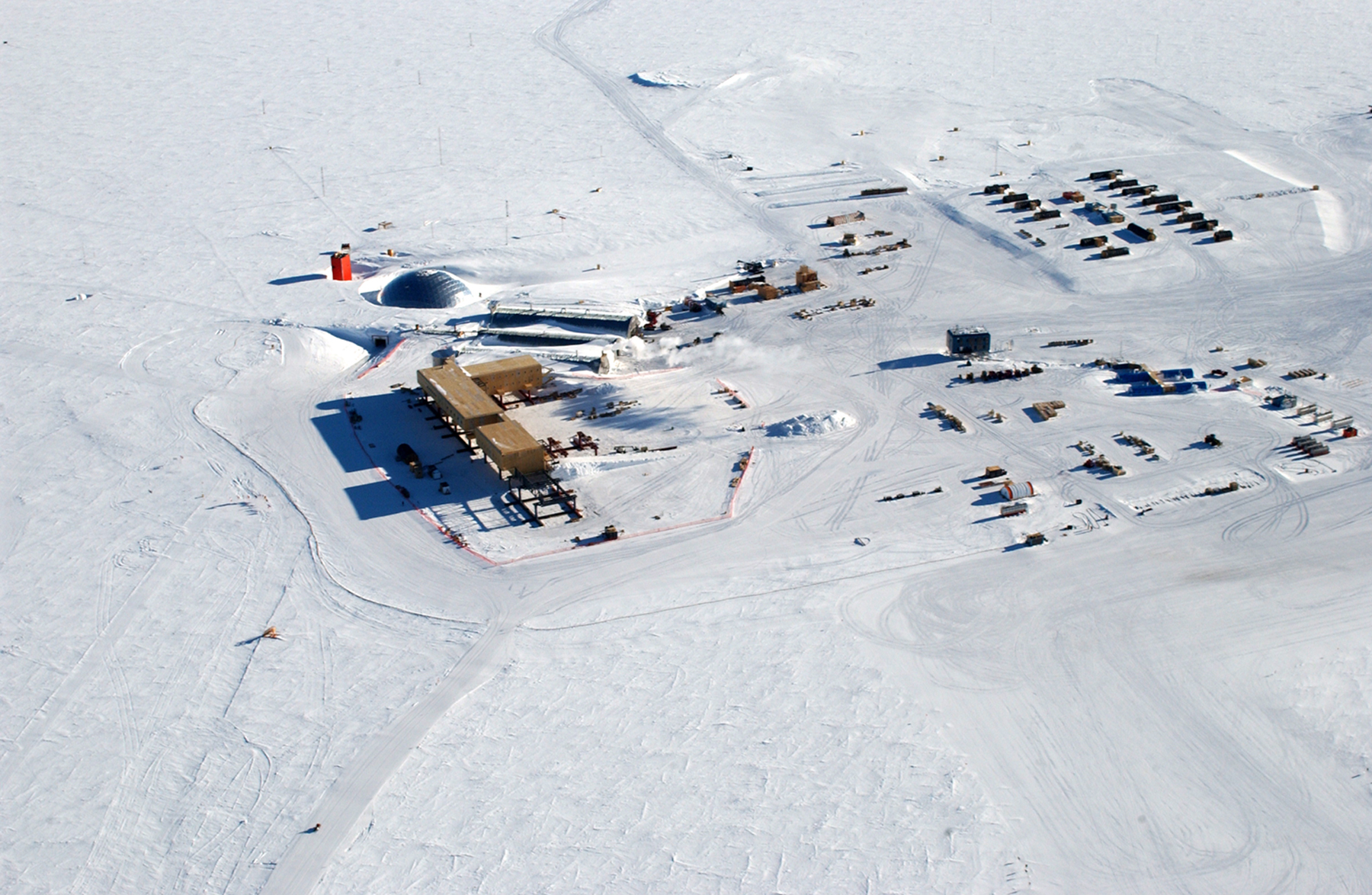 Aerial view of buildings on snow.