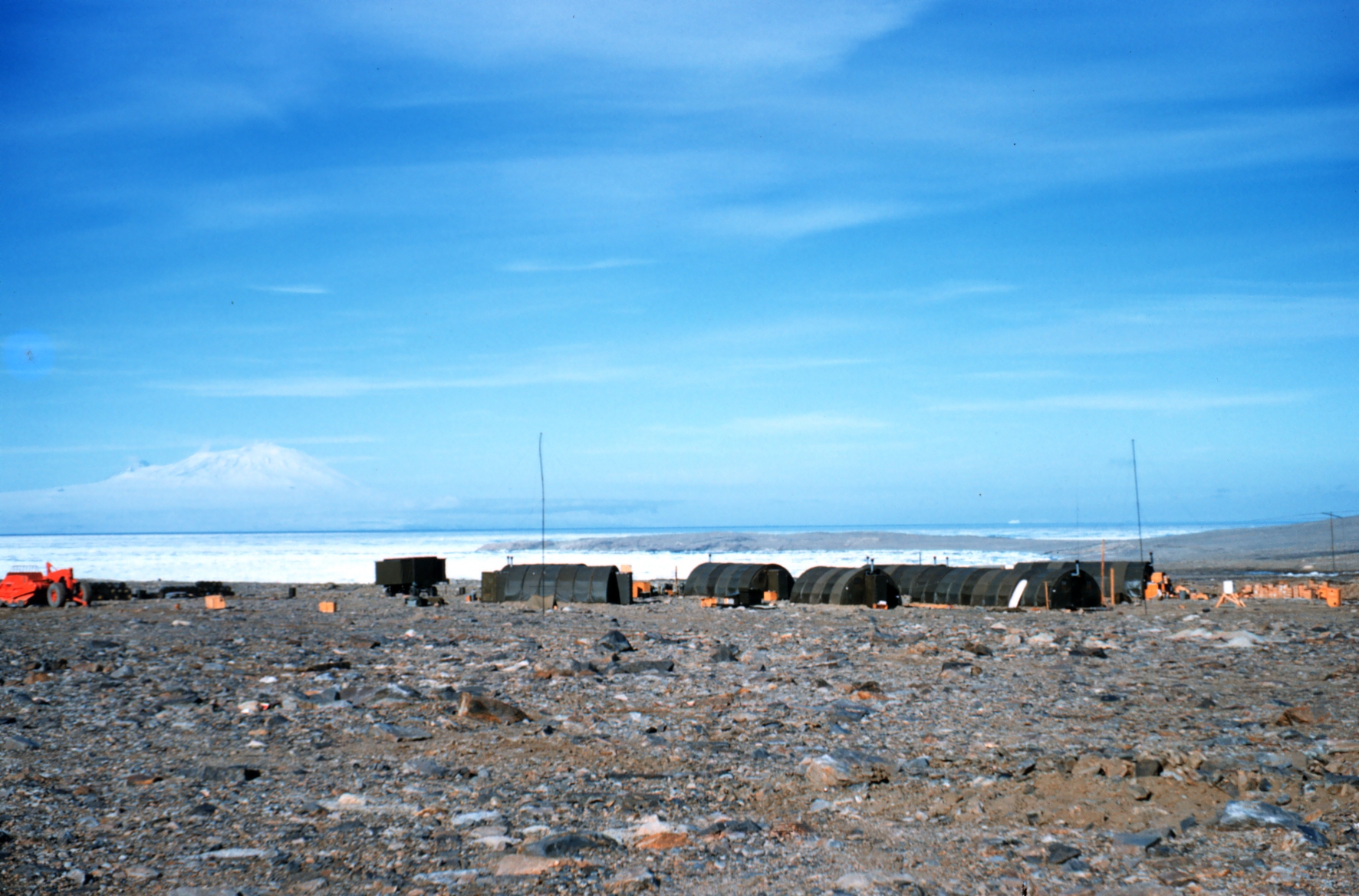 Small buildings on a rocky coastline.