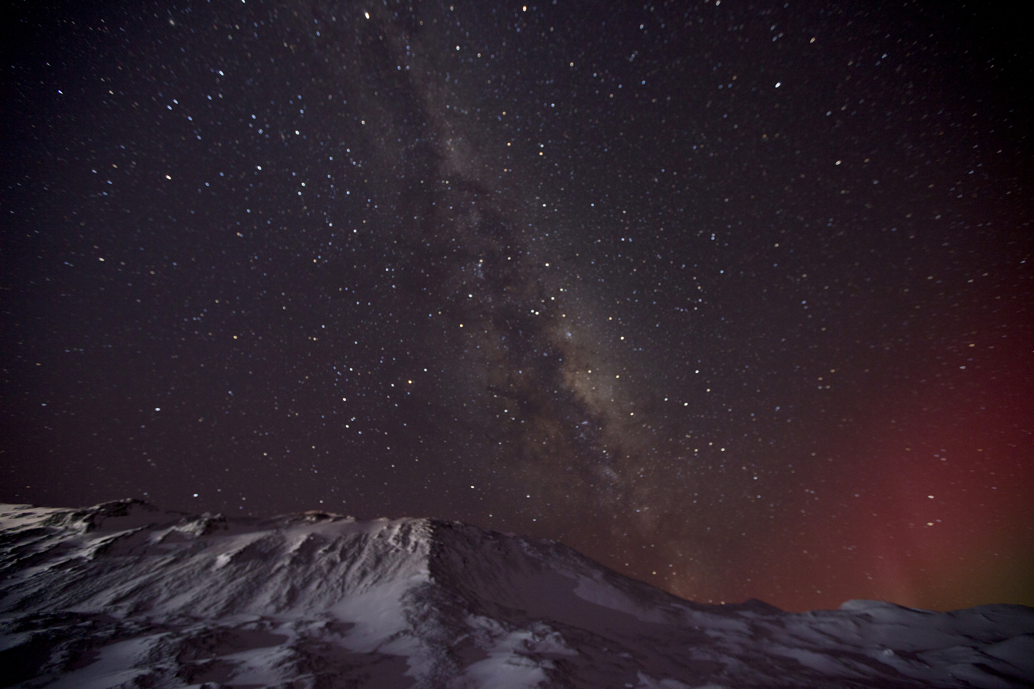 Aurora and Milky Way view of night sky.