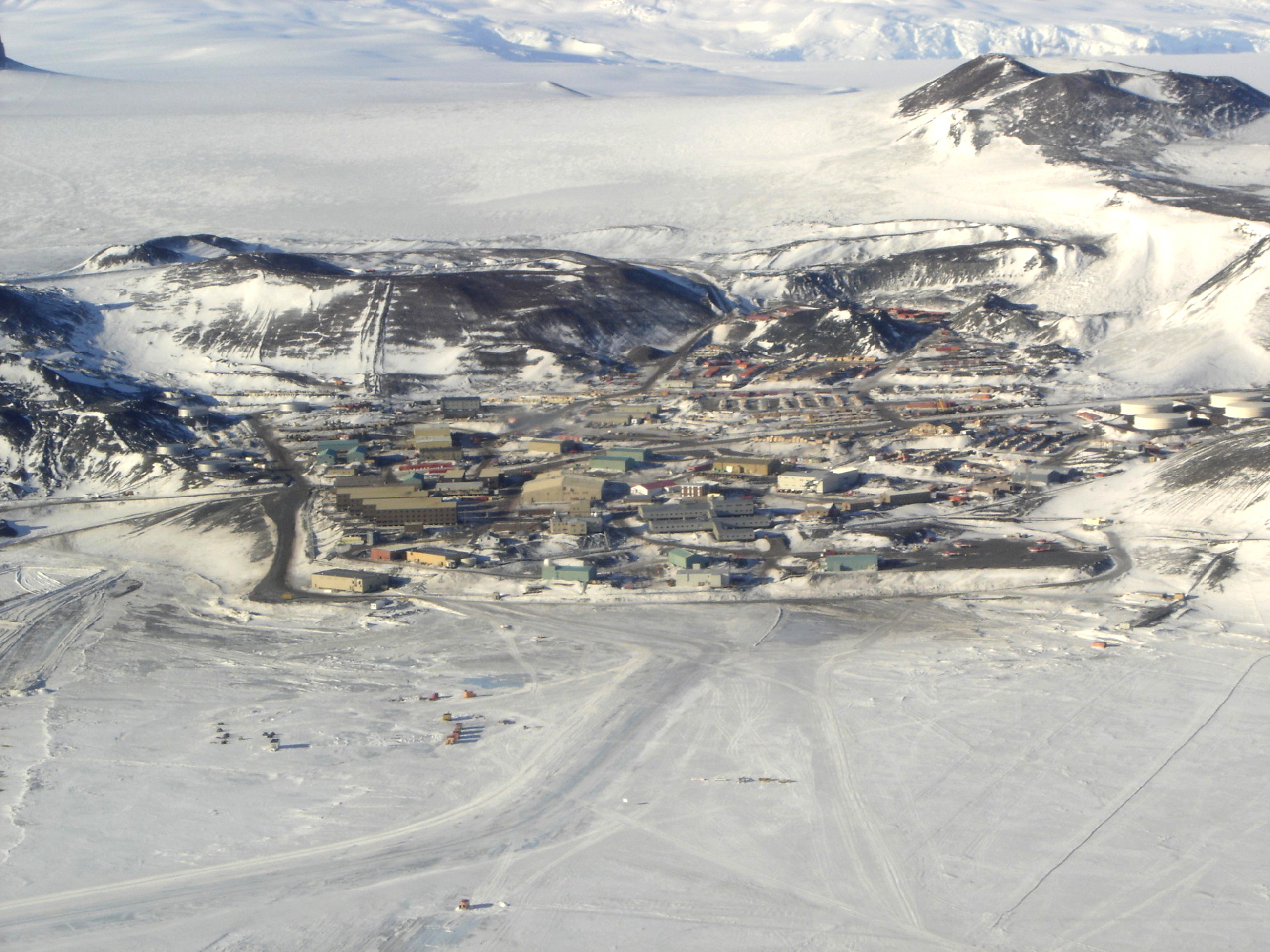 Aerial view of a small town surrounded by ice.