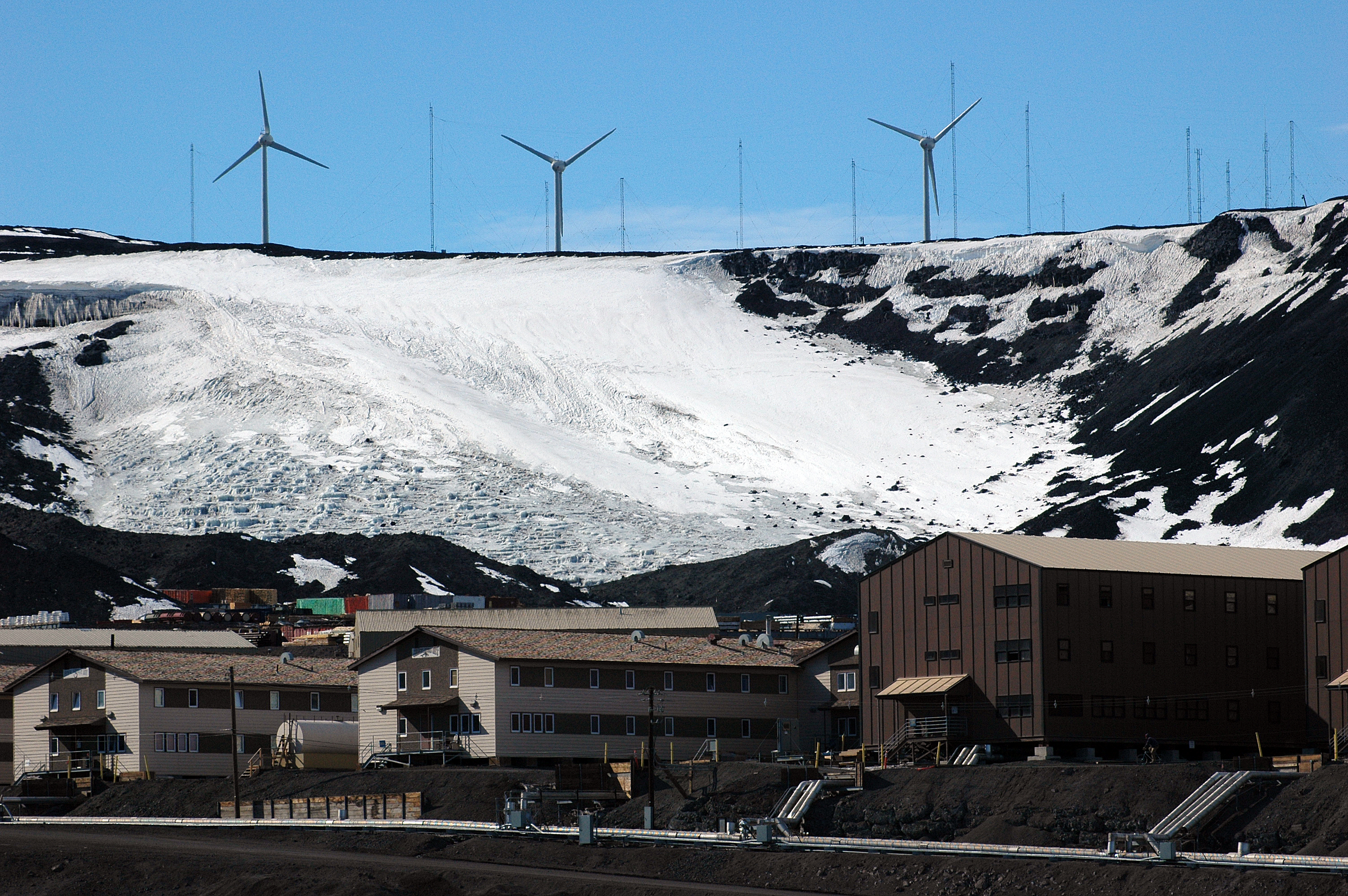 Wind turbines on a hill.