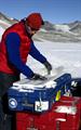 A man works with an ice core.