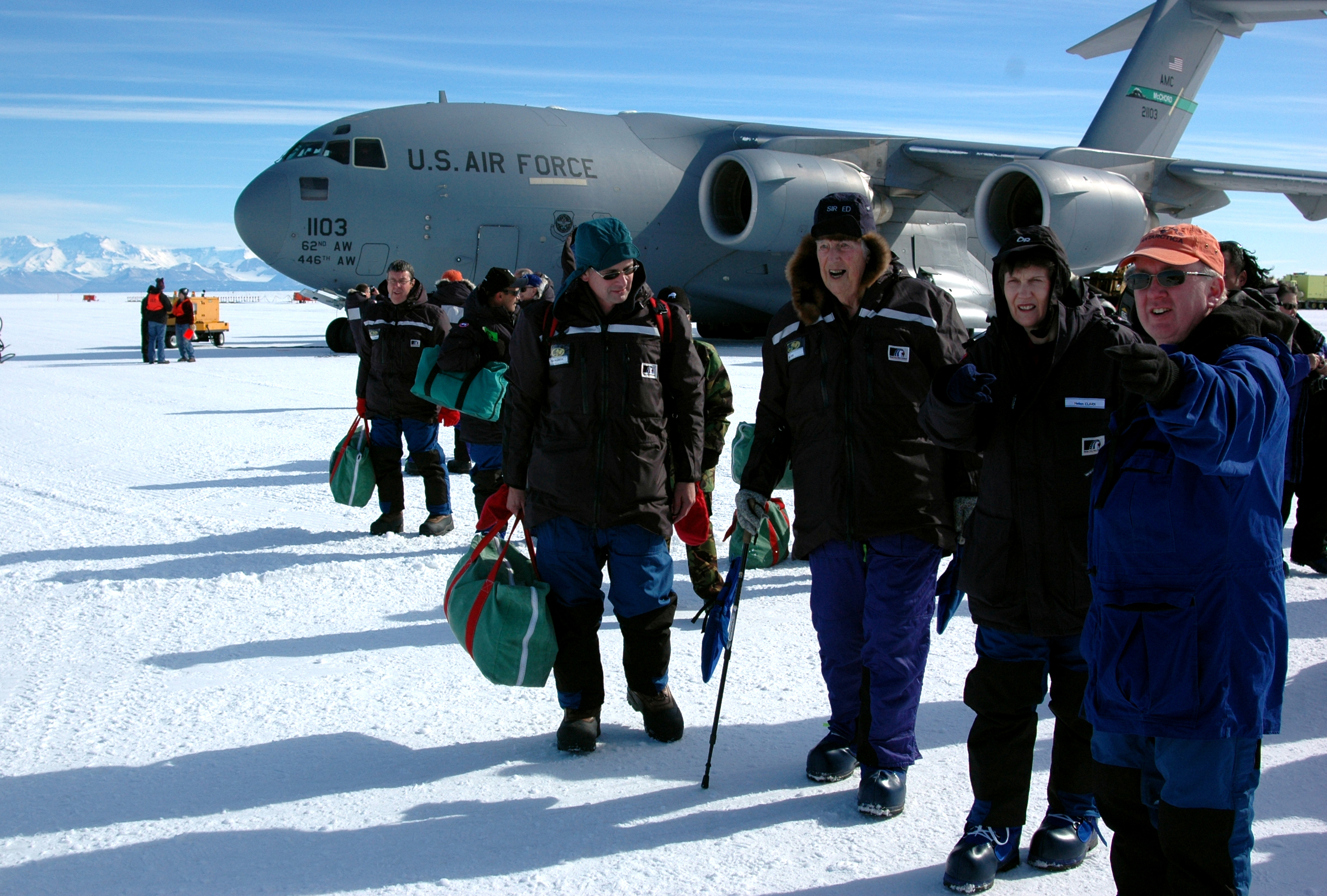 People in front of airplane.