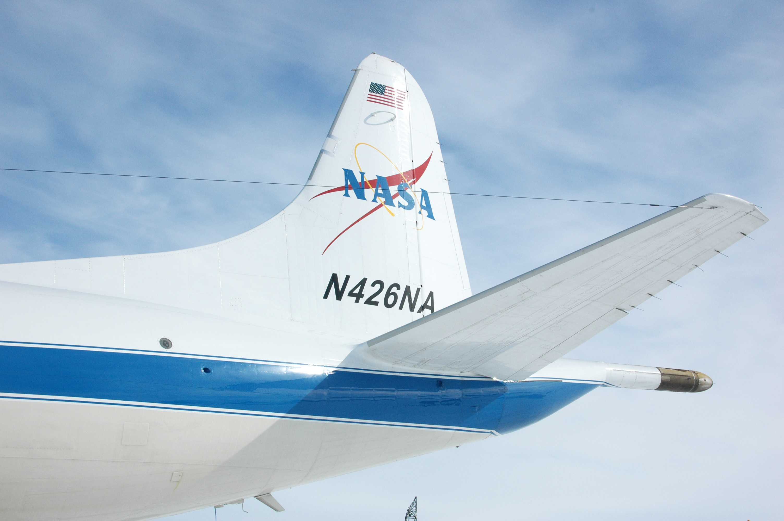 The NASA logo is on the tail of an airplane. 