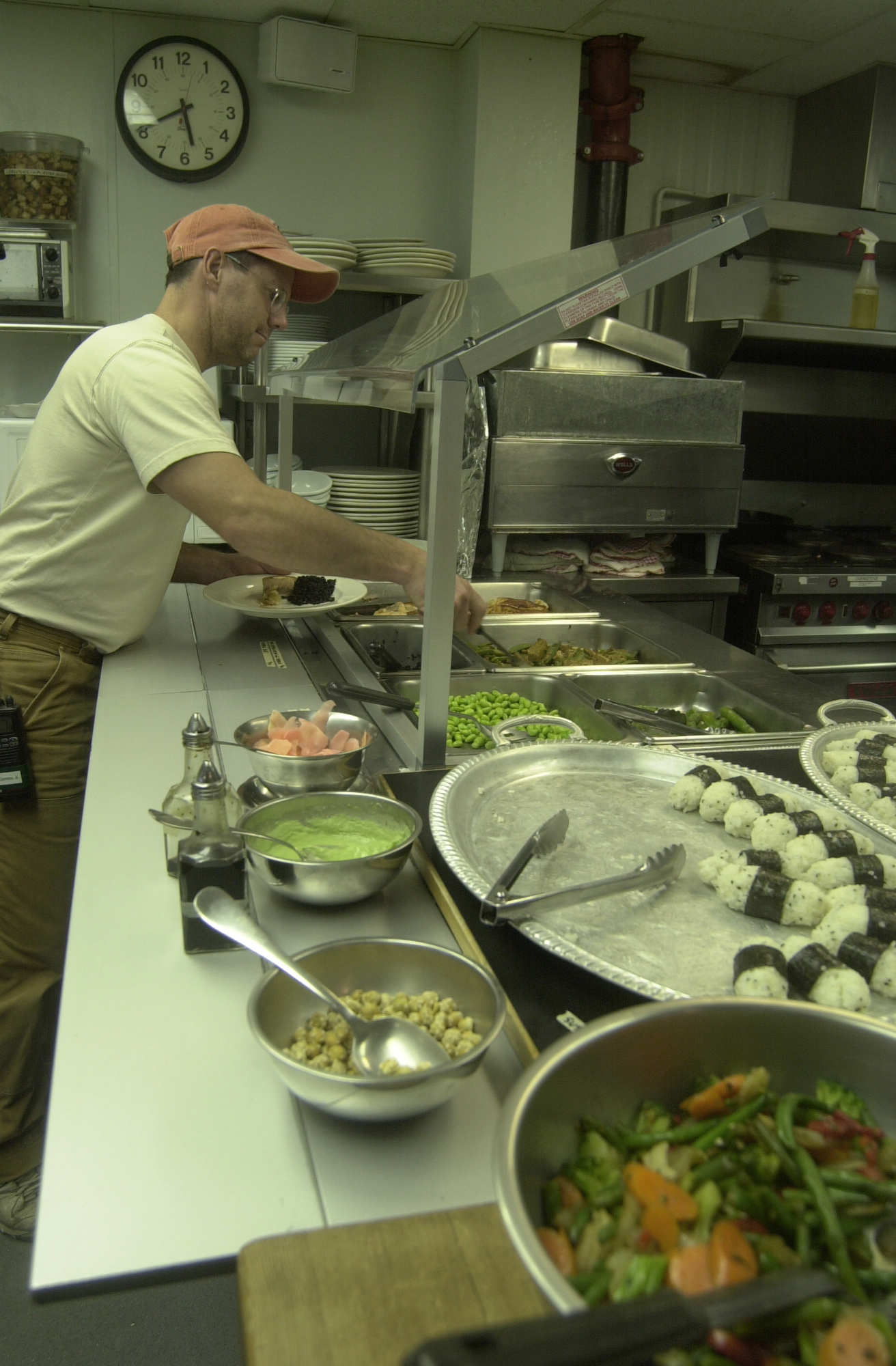 Man at food buffet.