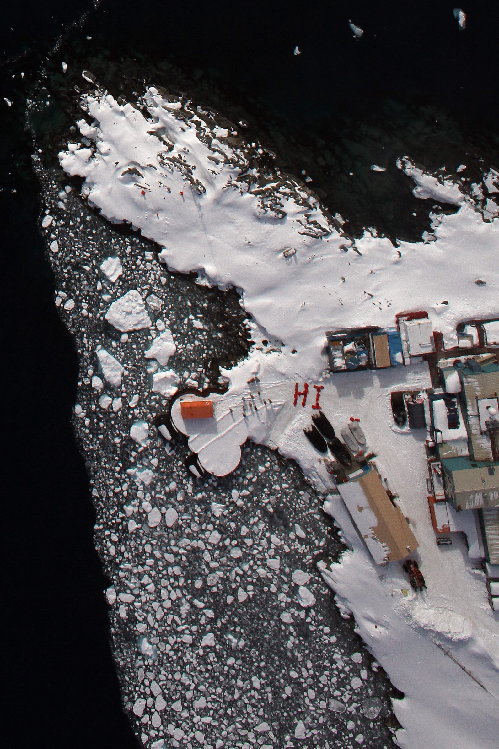 Aerial view of buildings on snow.