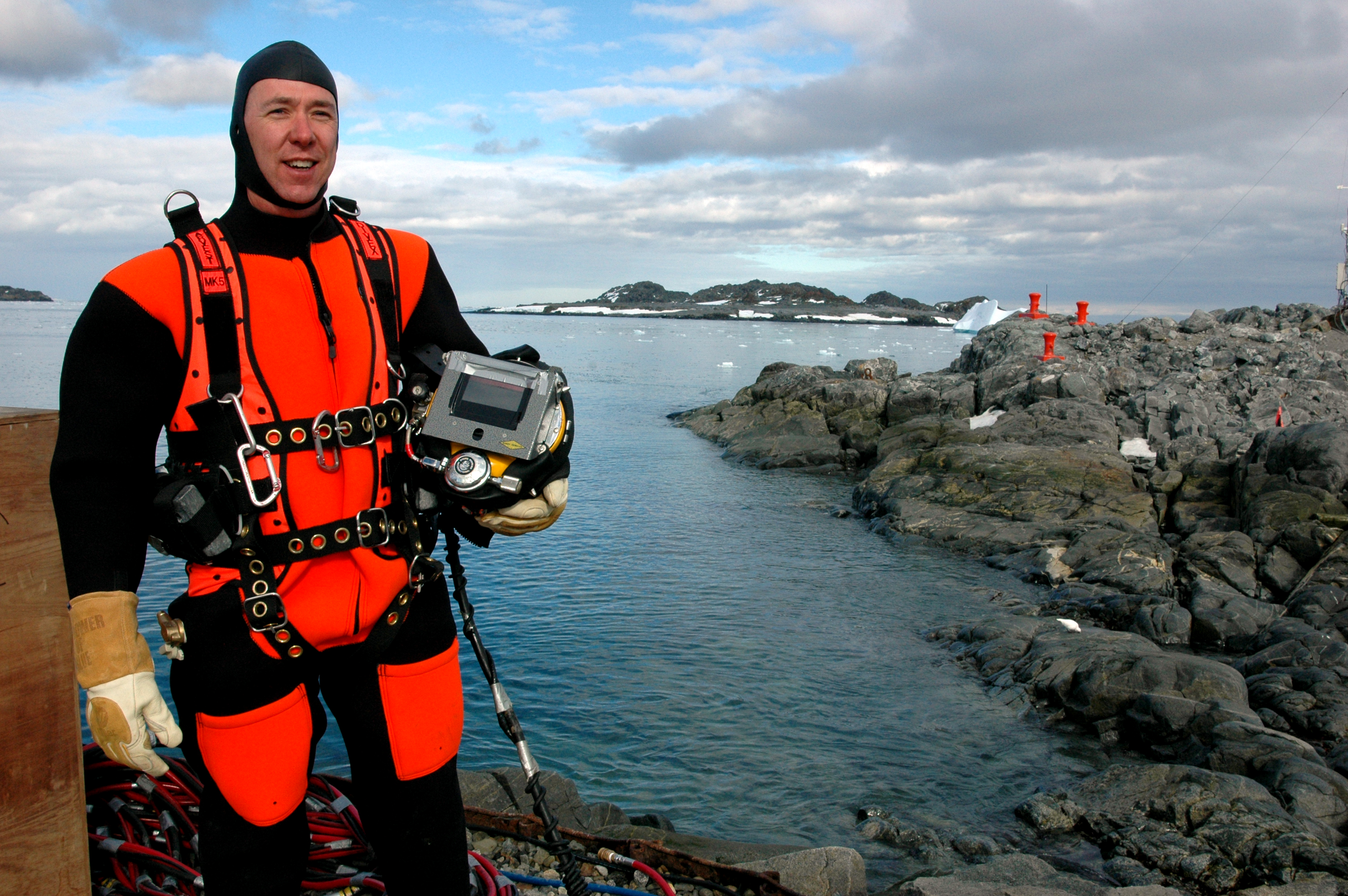 A man wears scuba diving gear.