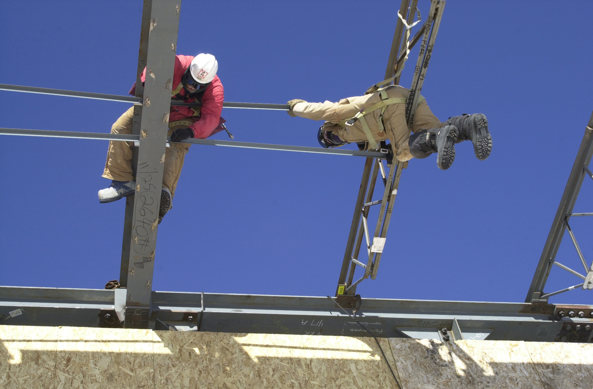 Men working on steel beams.