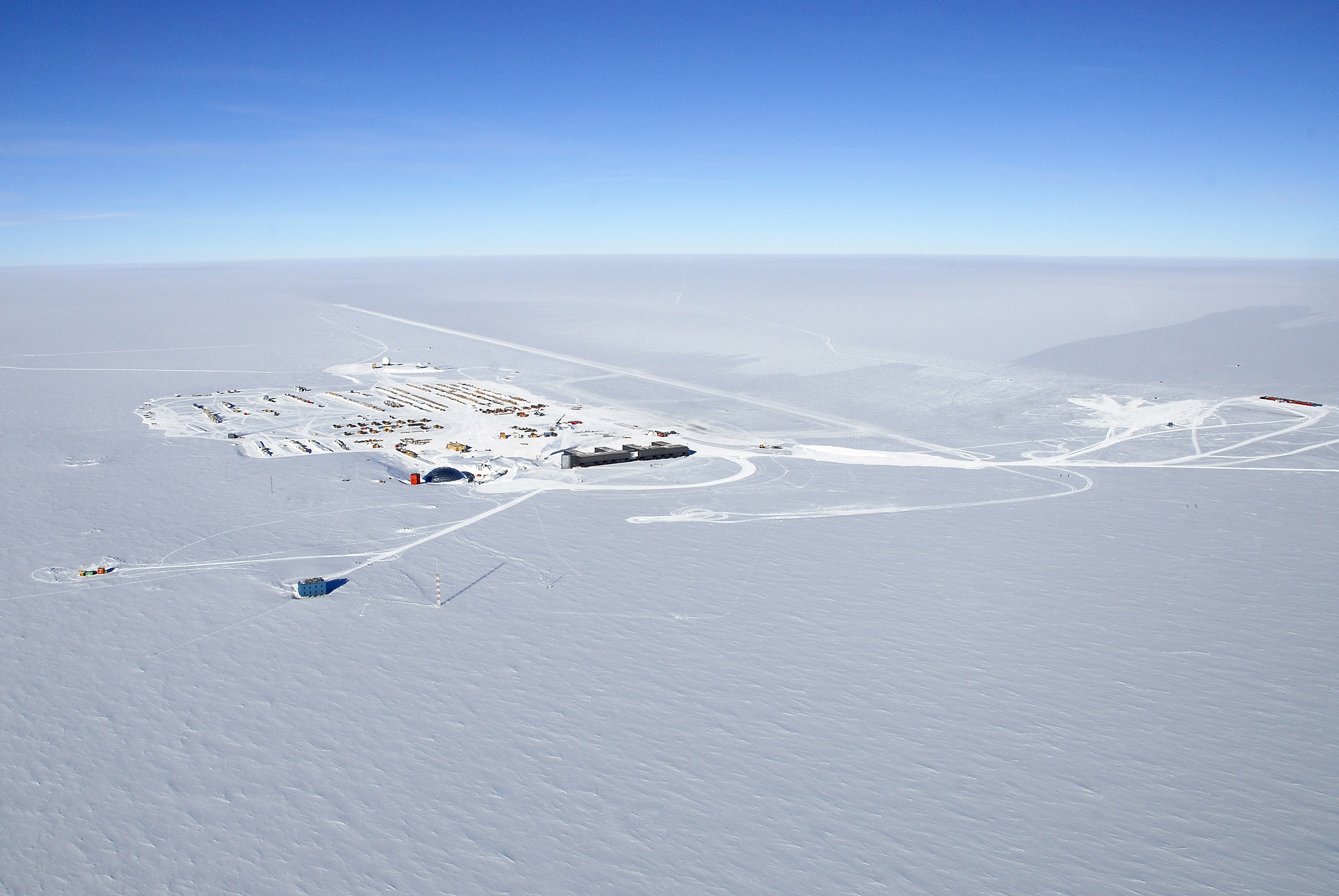 Aerial photo of buildings on snow.