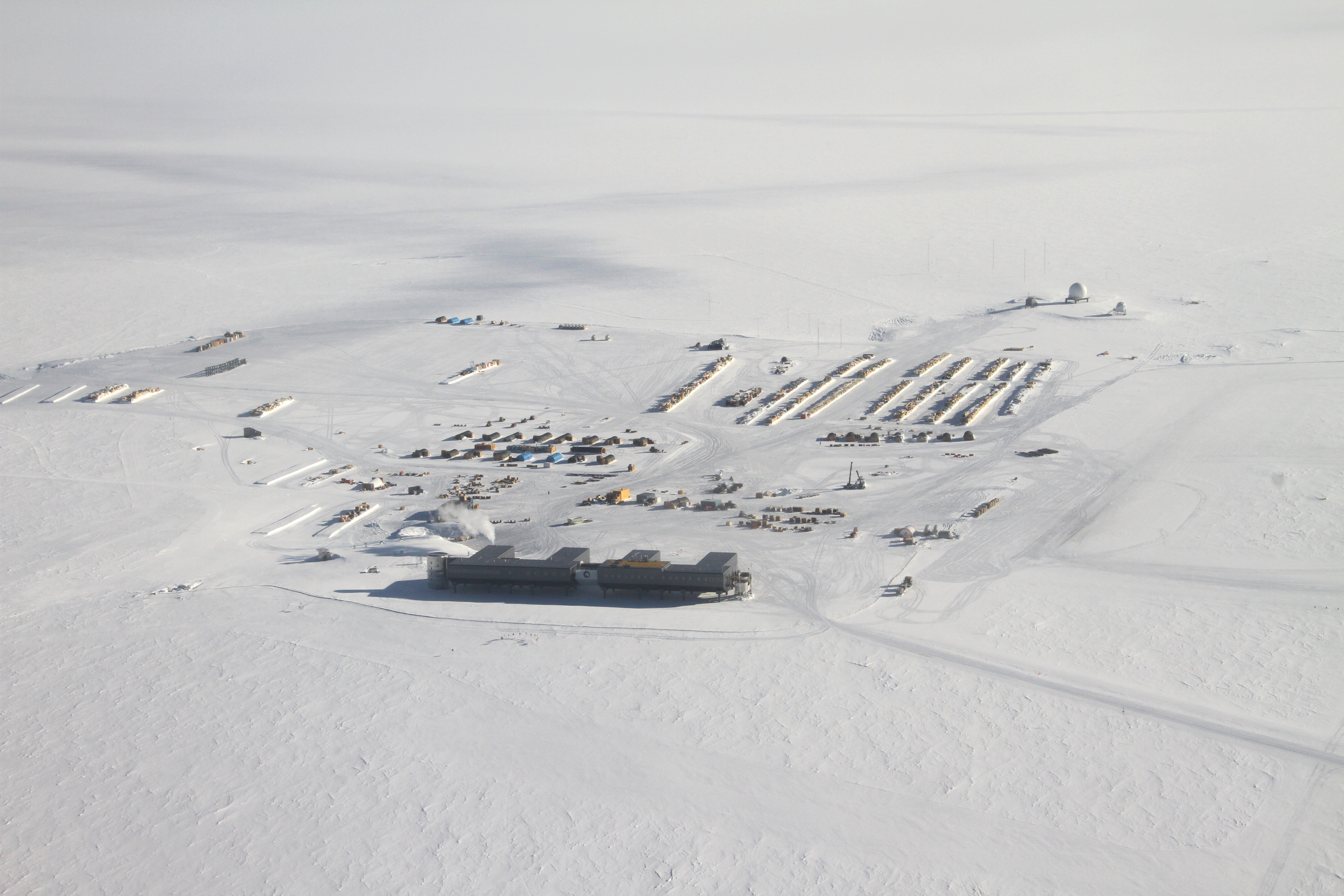 Aerial photo of buildings on snow.