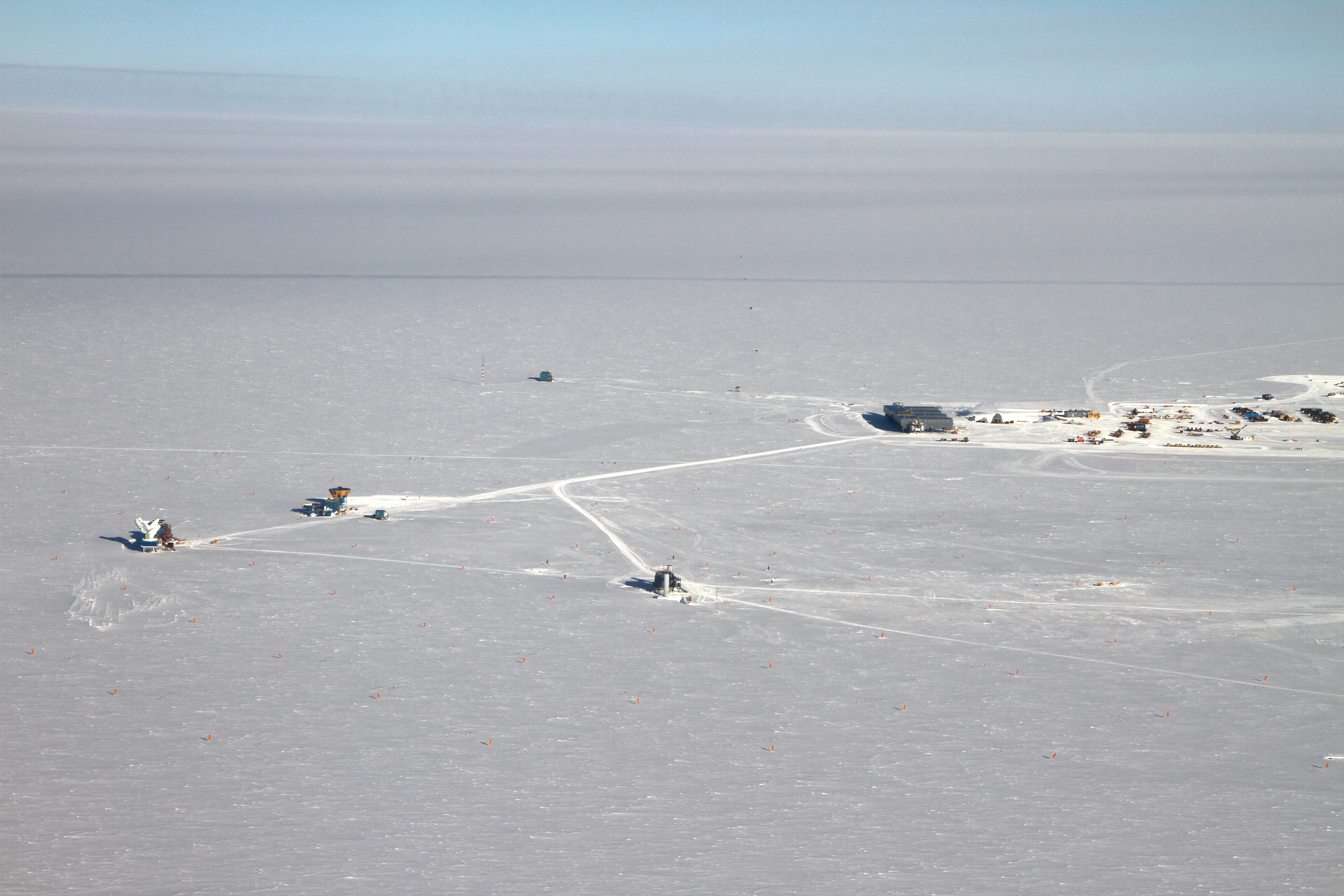 Aerial photo of buildings on snow.