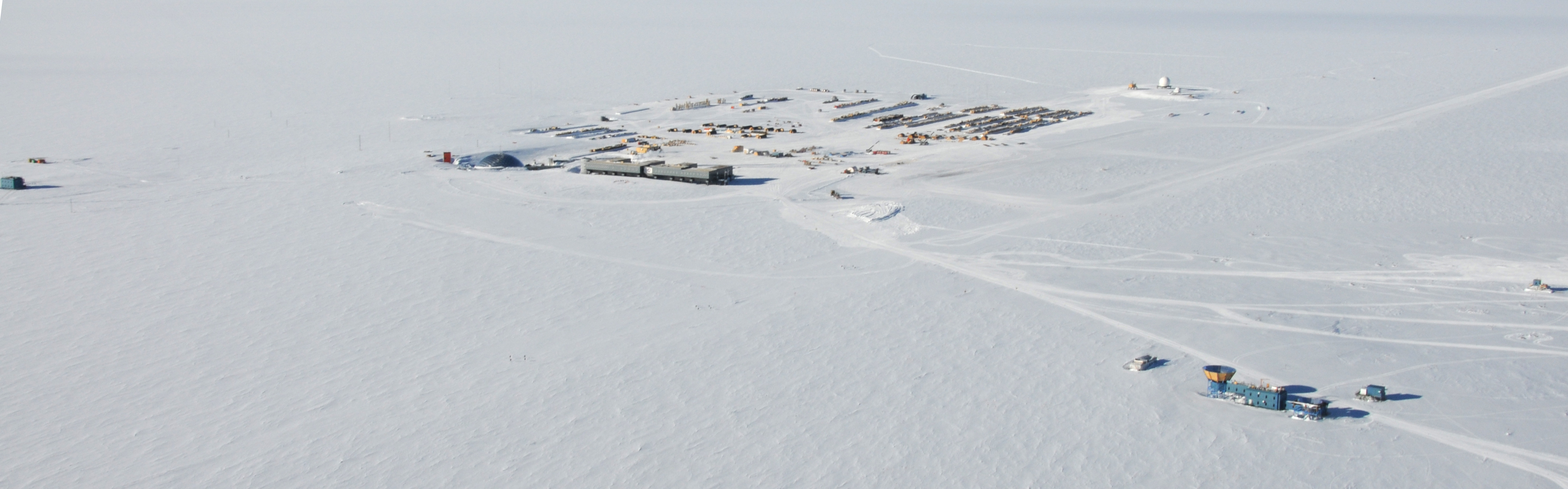 Aerial photo of buildings on snow.