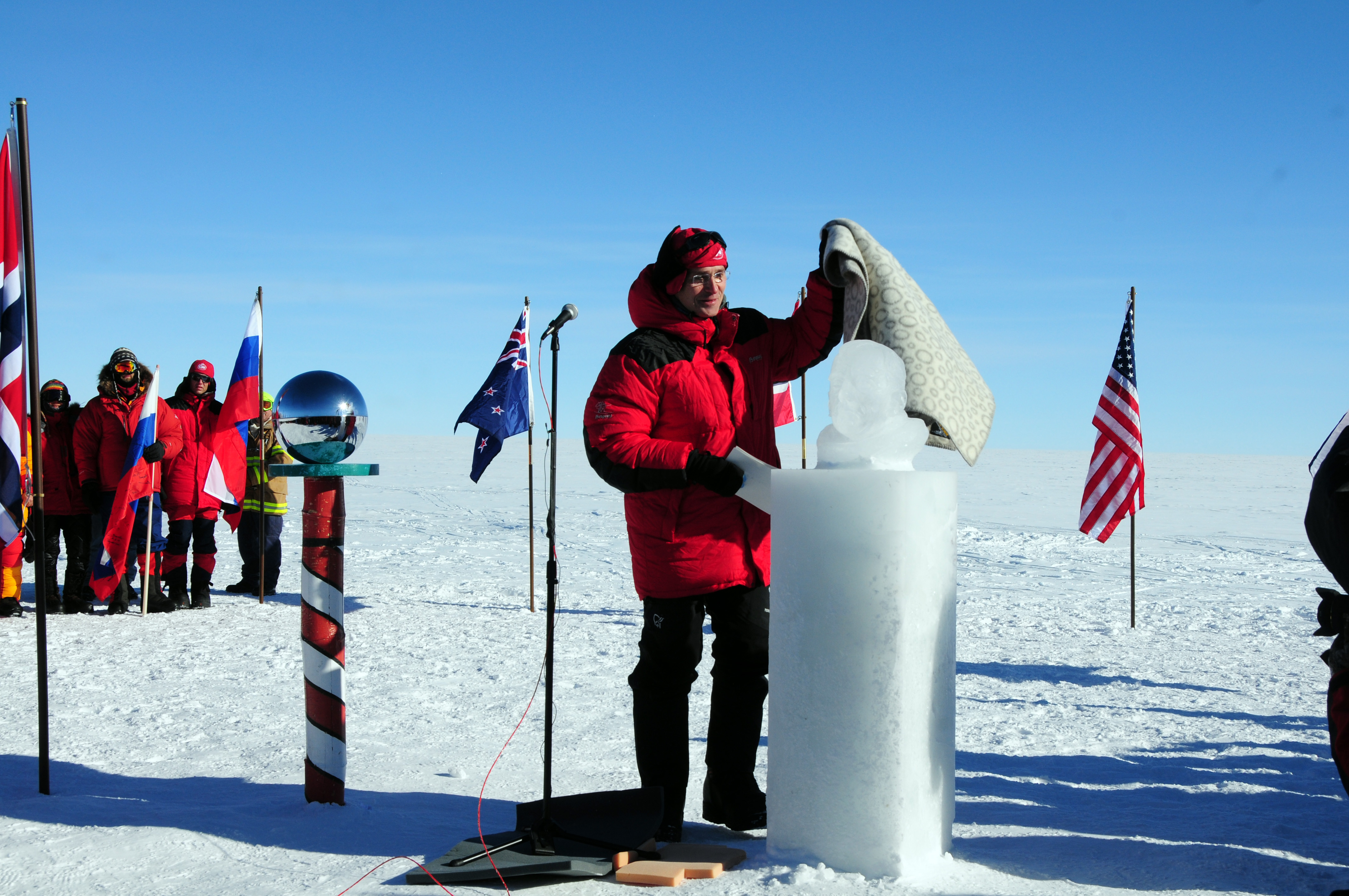 Person unveils frozen but during ceremony.