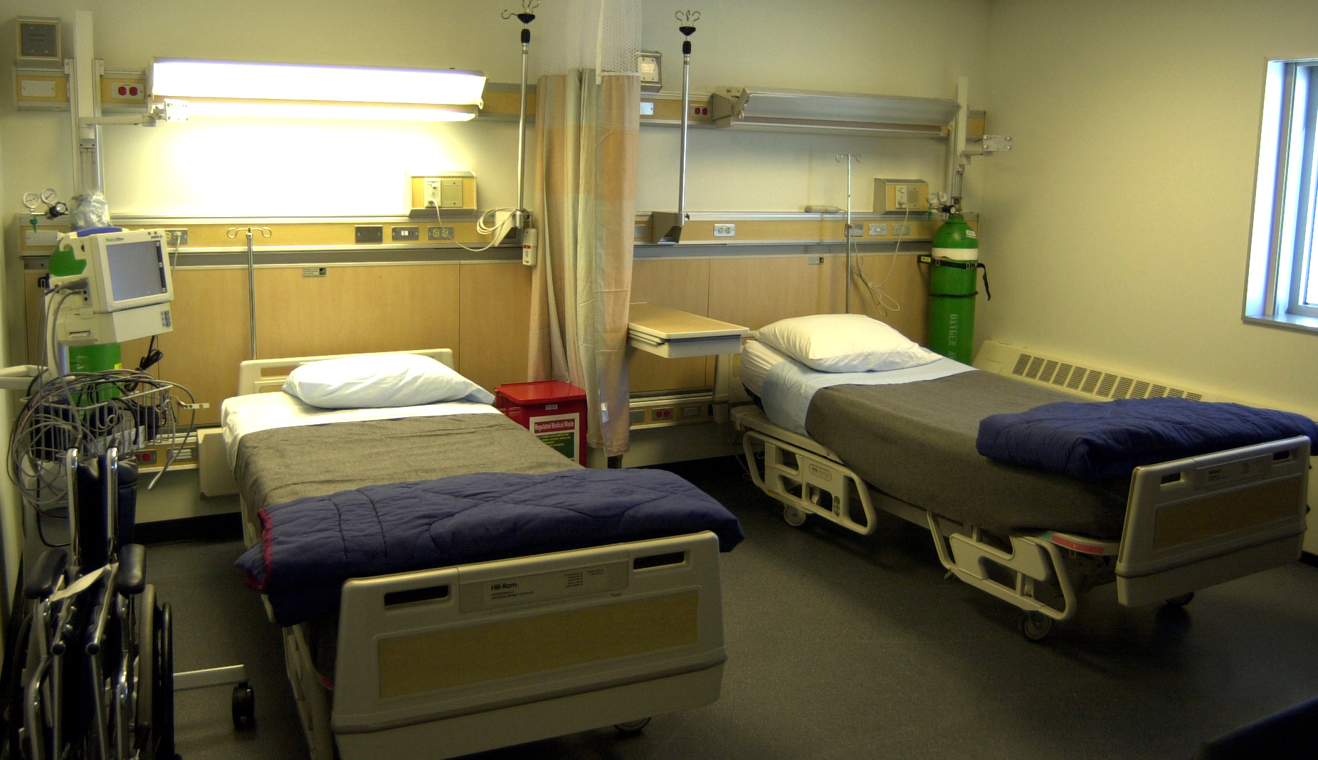 A hospital room with two beds.
