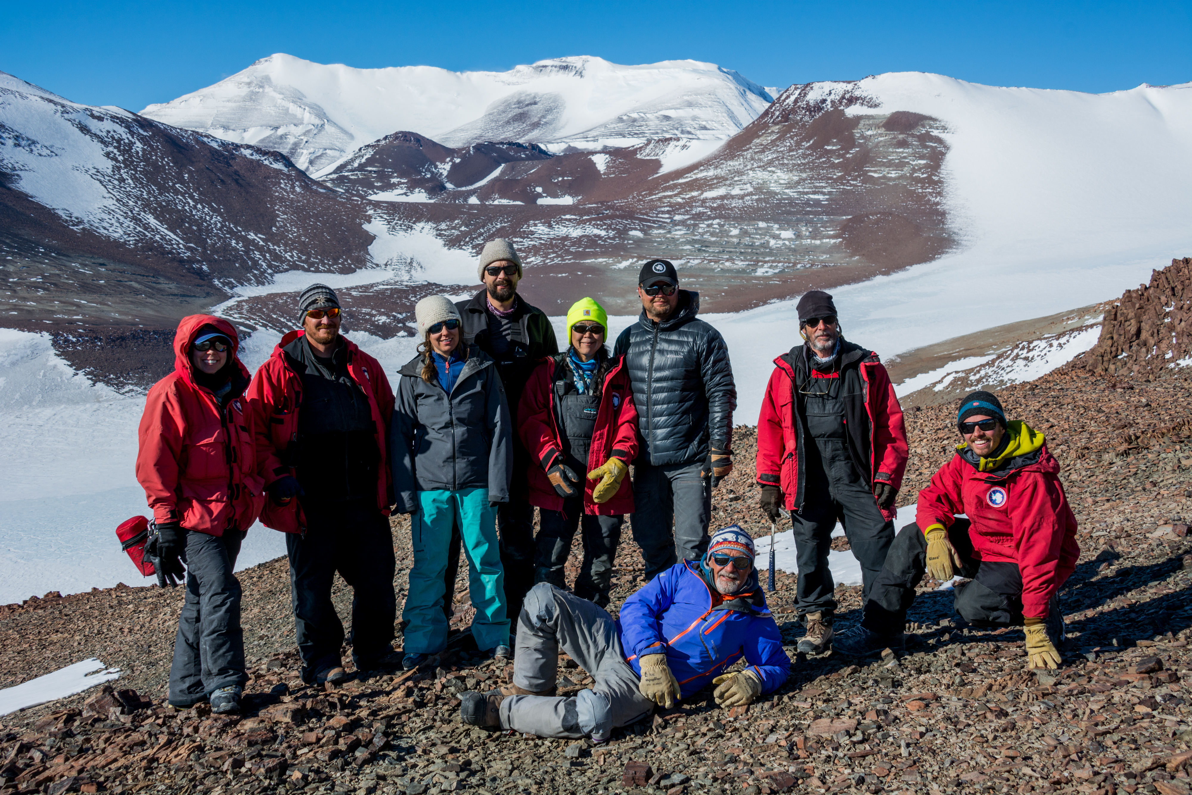 A team of scientists pose for a group photo.