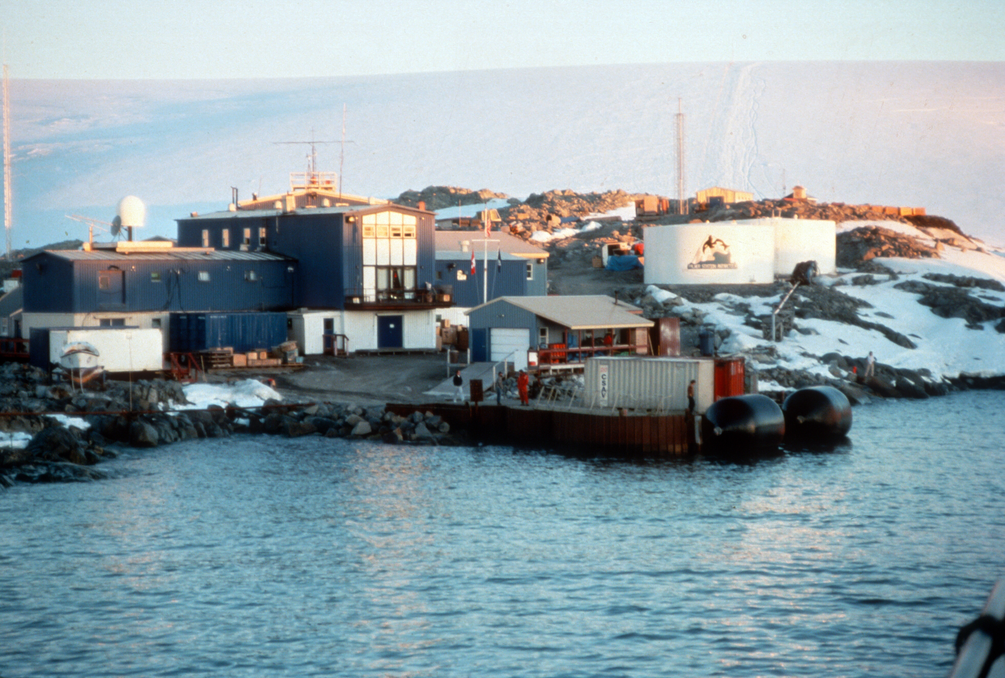 Several buildings near the water's edge.