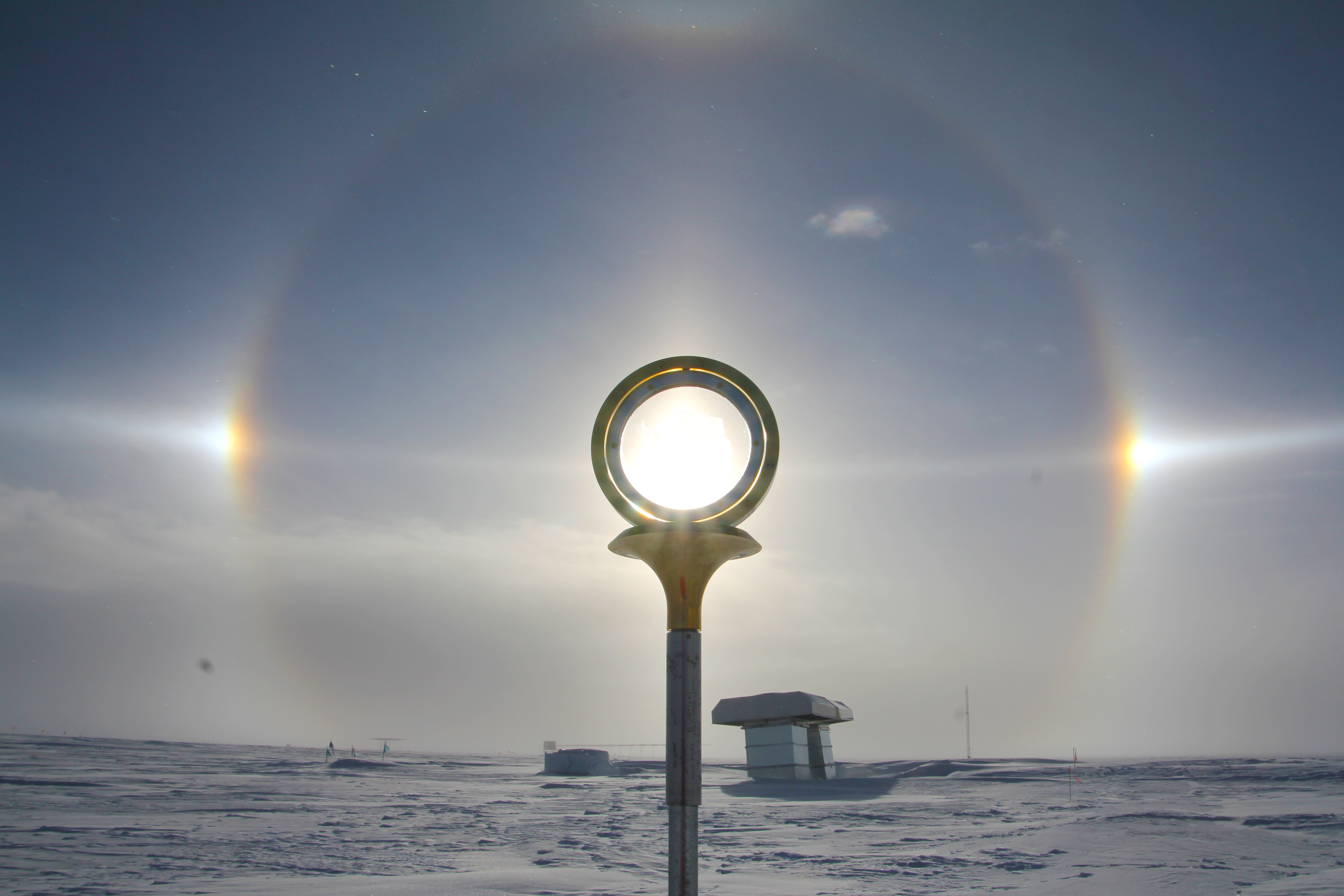 A sundog appears around a geographic marker.