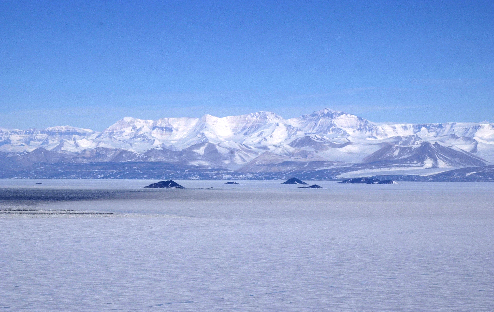 Snowy mountains sit in the distance.