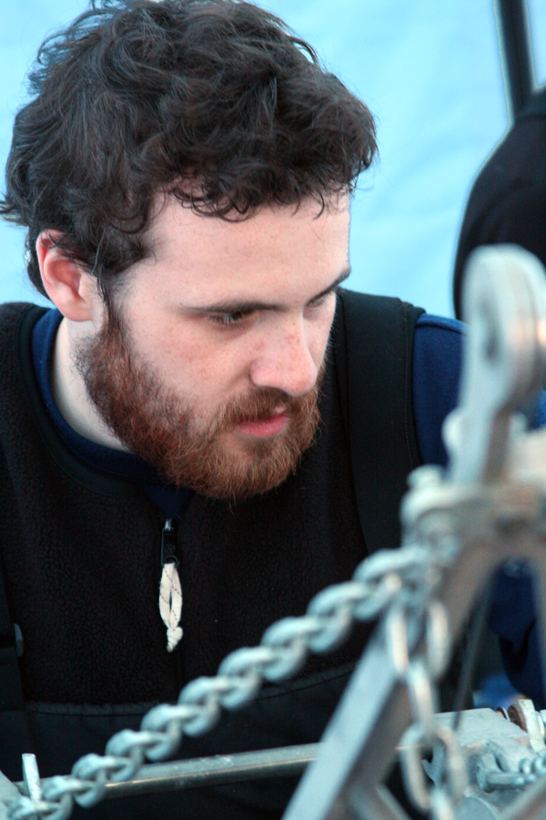 A man with metal object in front of him.