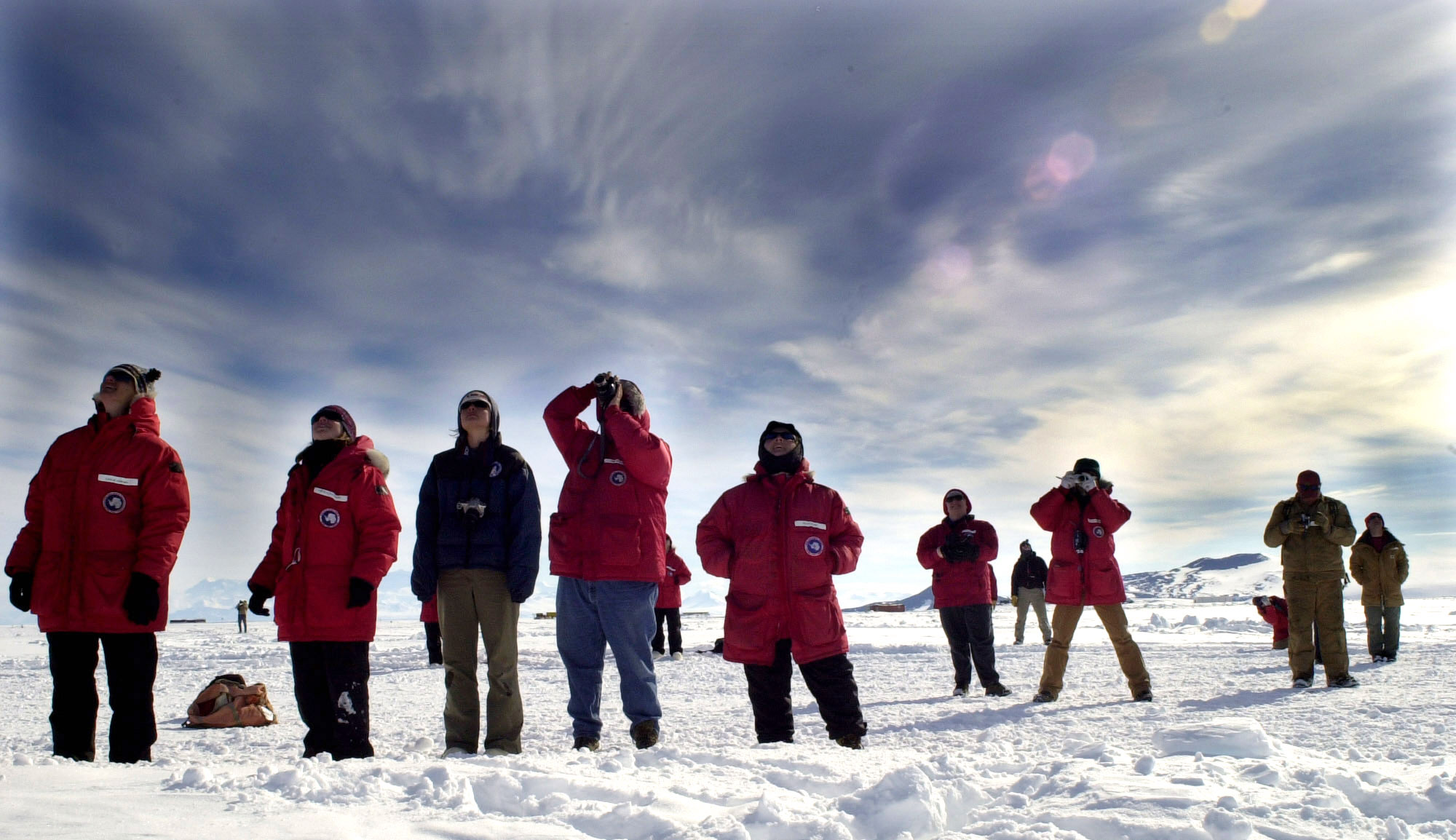 People look into the sky.