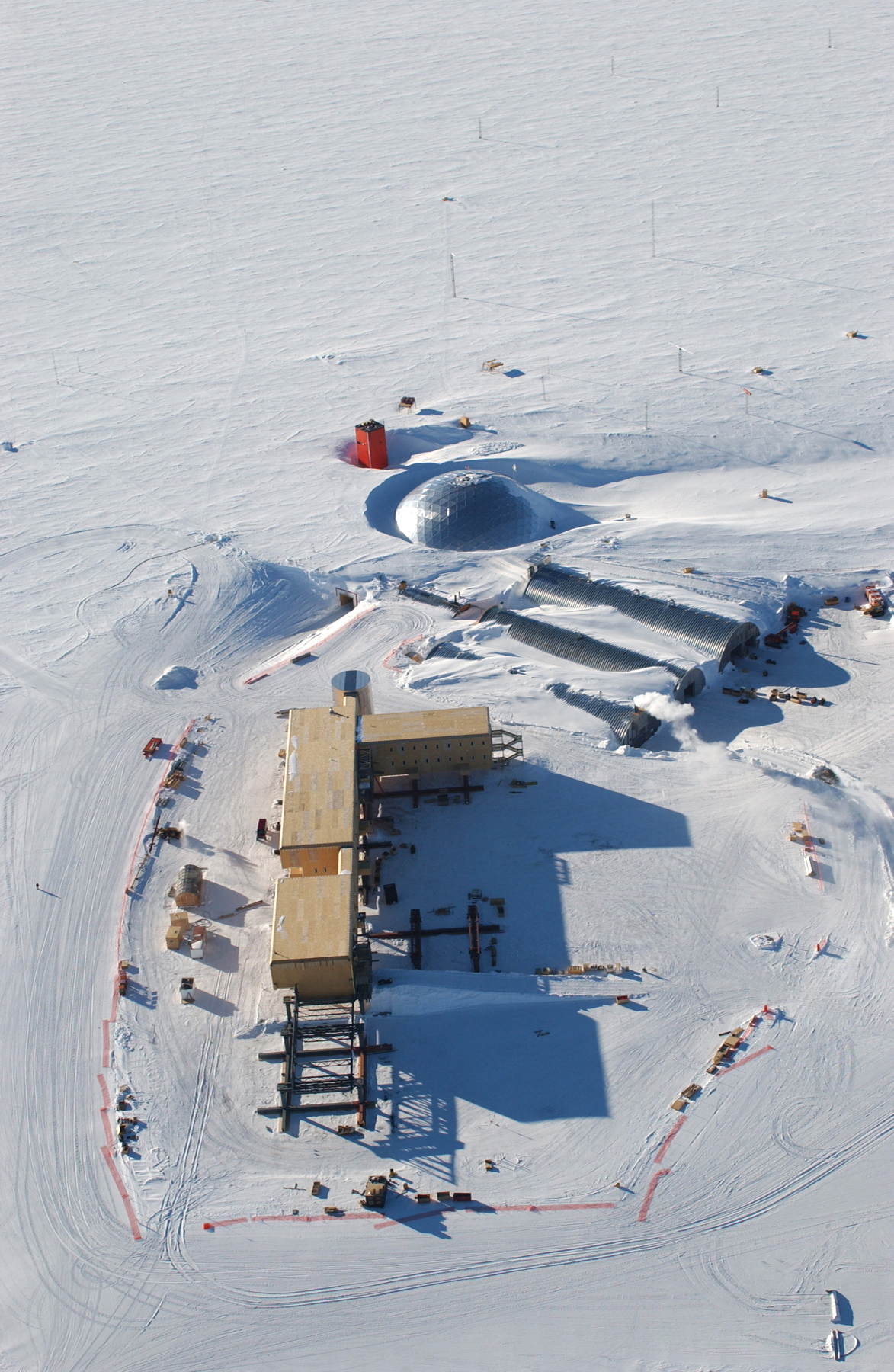 Aerial view of buildings surrounded by snow.