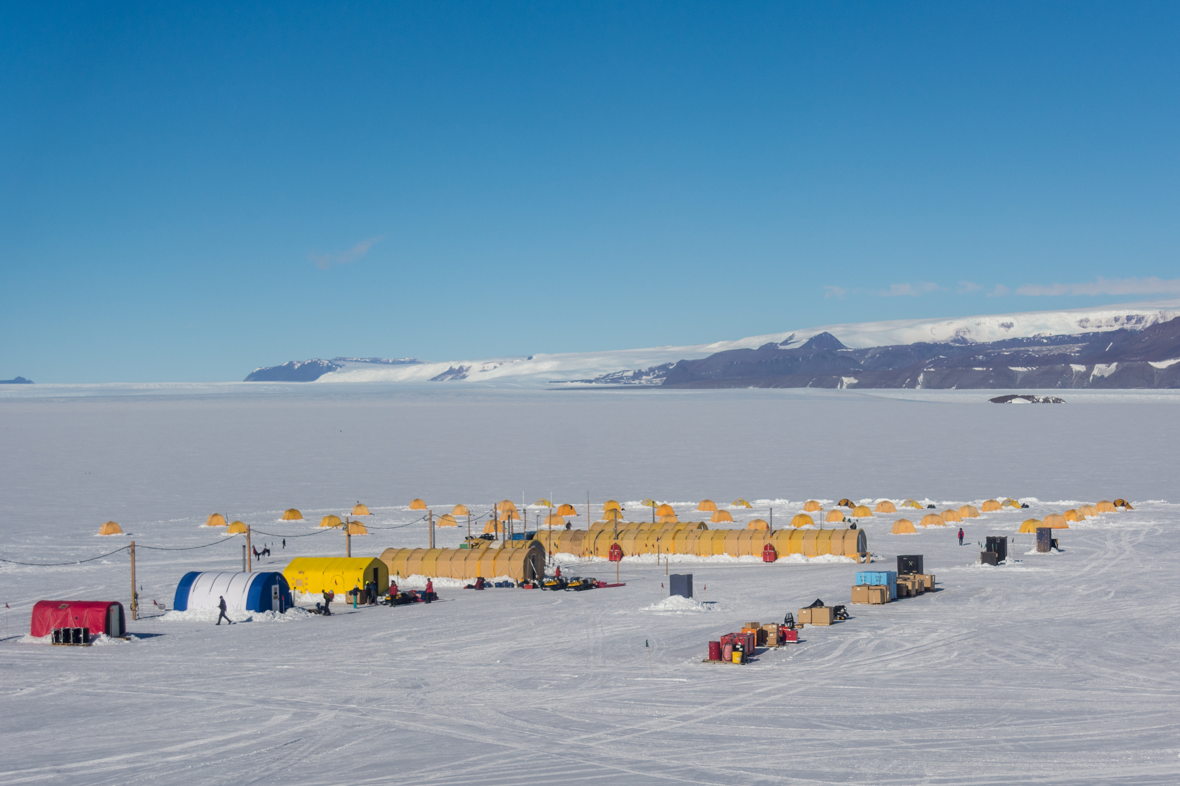 Tents set up atop a glacier.