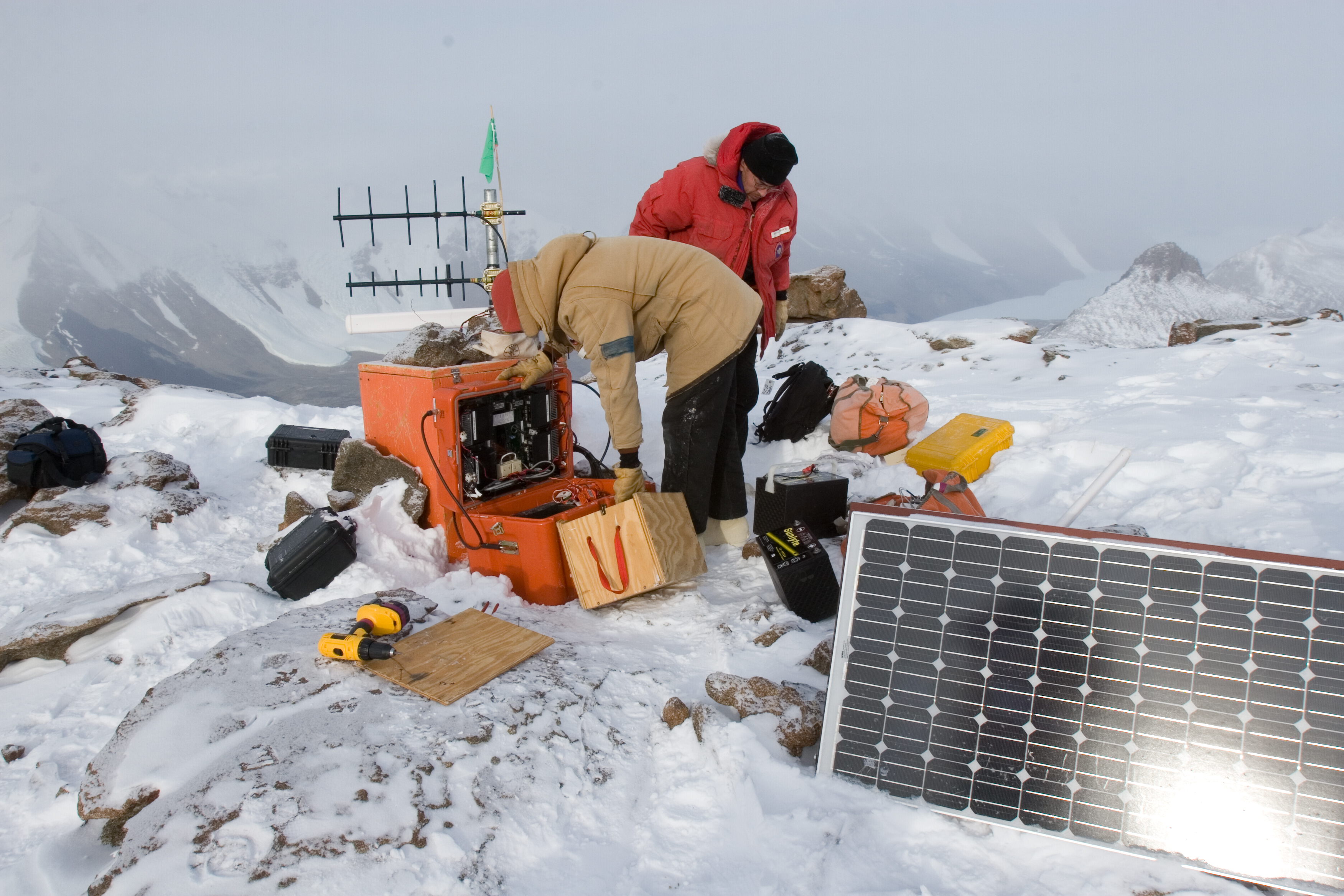 People working in the snow.