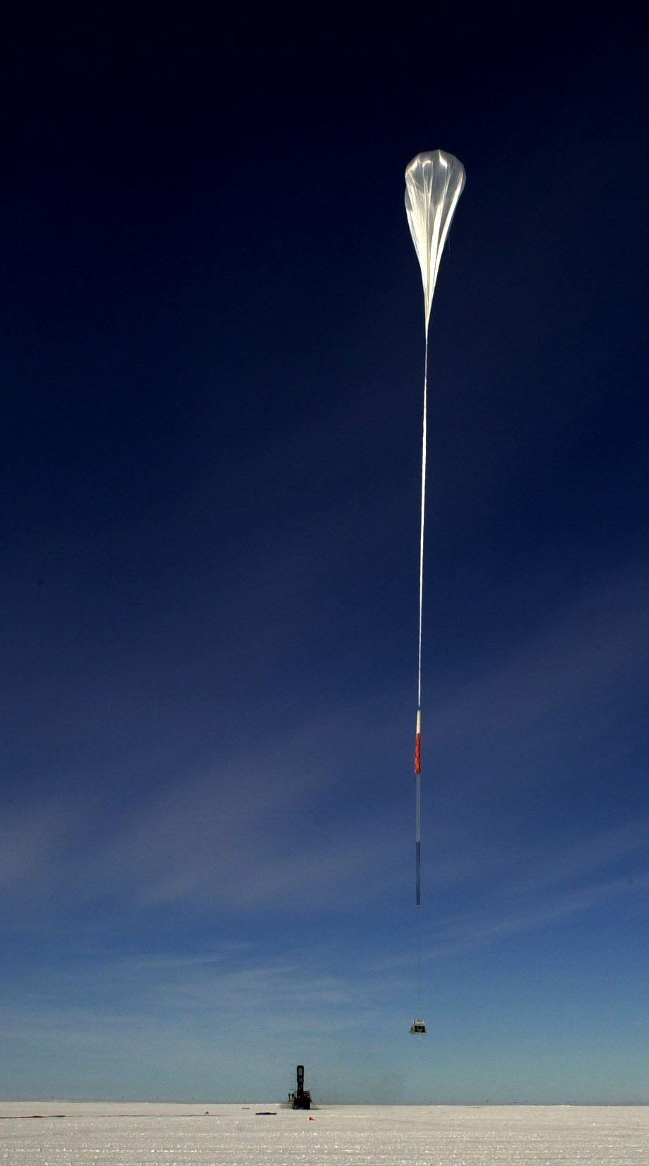 A giant balloon floats away.