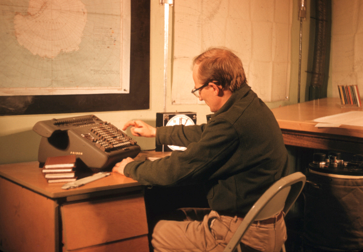 A man sitting at a desk.