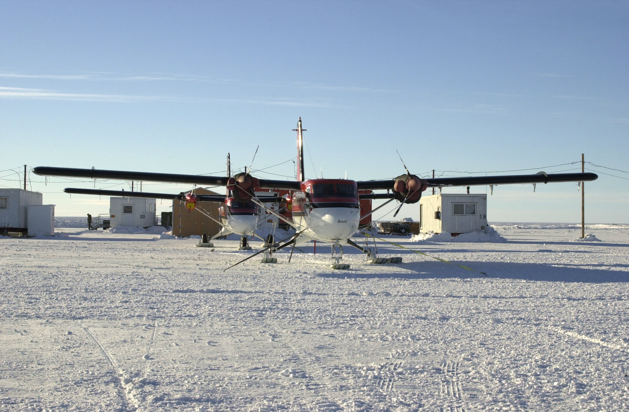 Two planes on the snow-covered ground.