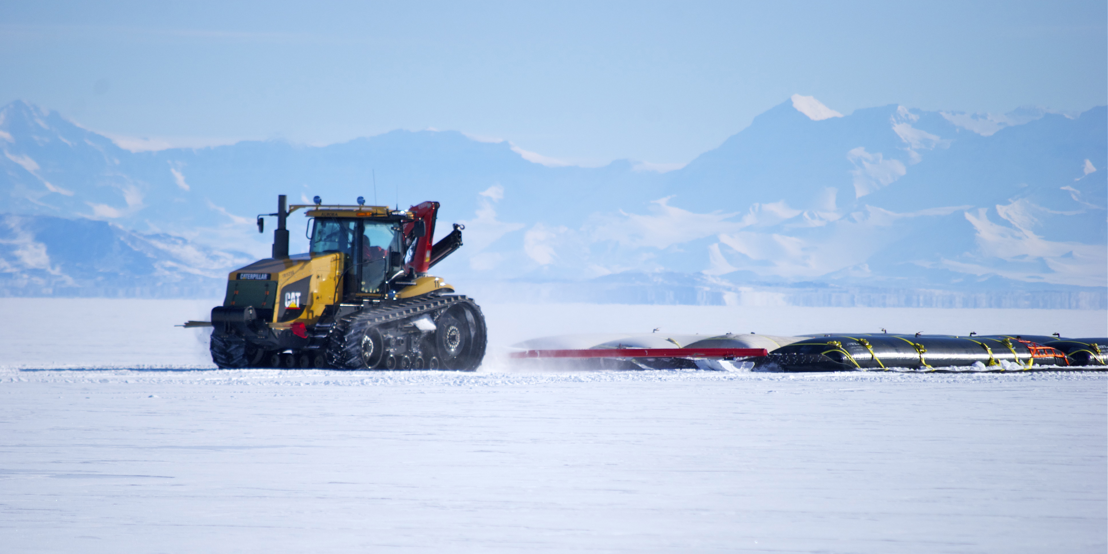 A tractor pulling a sled.